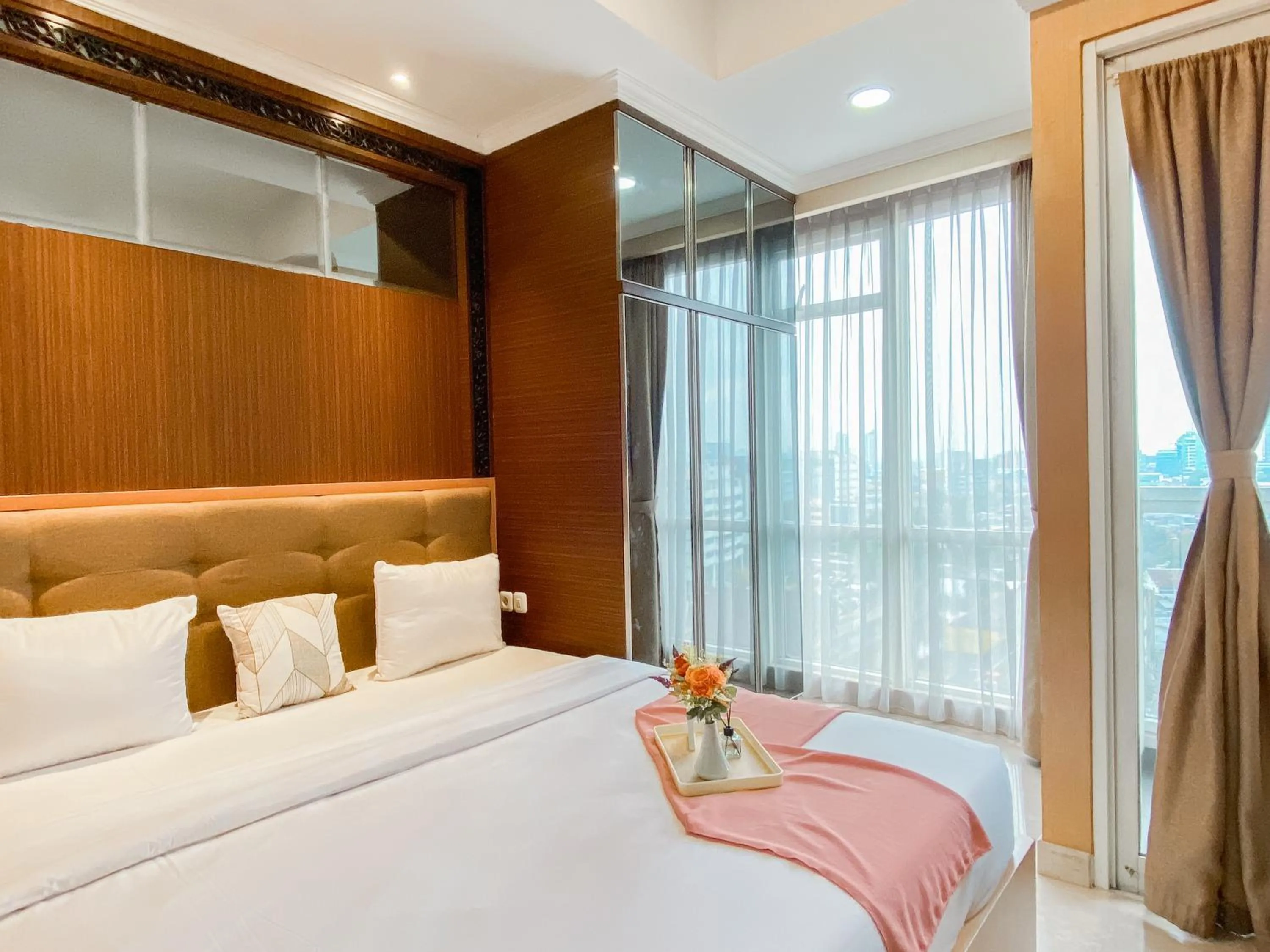 Bed in Lovely Studio Menteng Park Apartment By Travelio