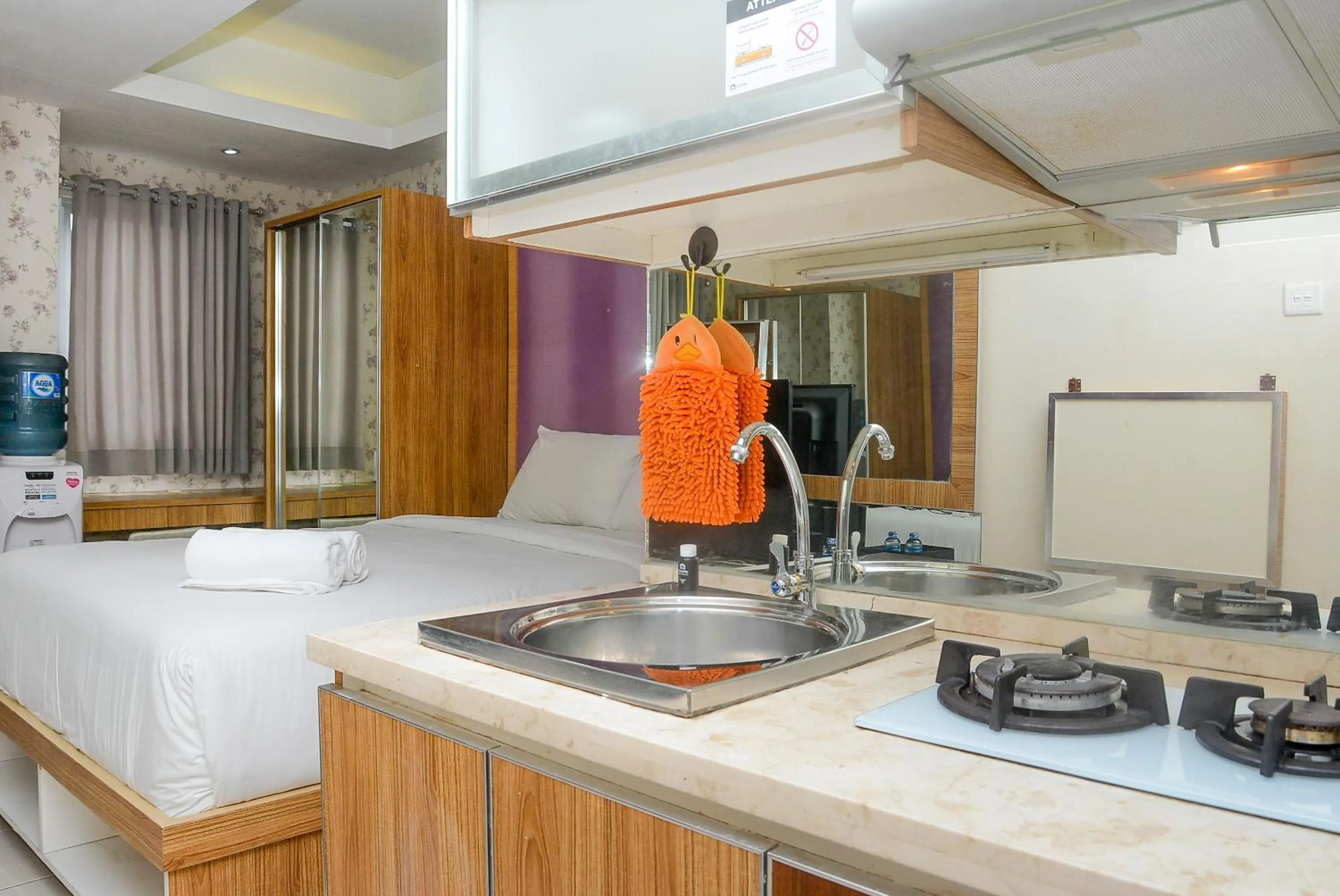 Photo of the whole room, Bed in Homey Studio Pakubuwono Terrace Apartment By Travelio