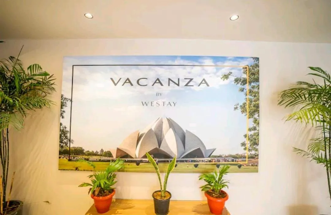 Property logo or sign in Vacanza by Westay Luxury Home