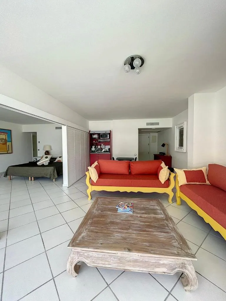 Kitchen or kitchenette, Bed in Le Domaine Anse Marcel Beach Resort