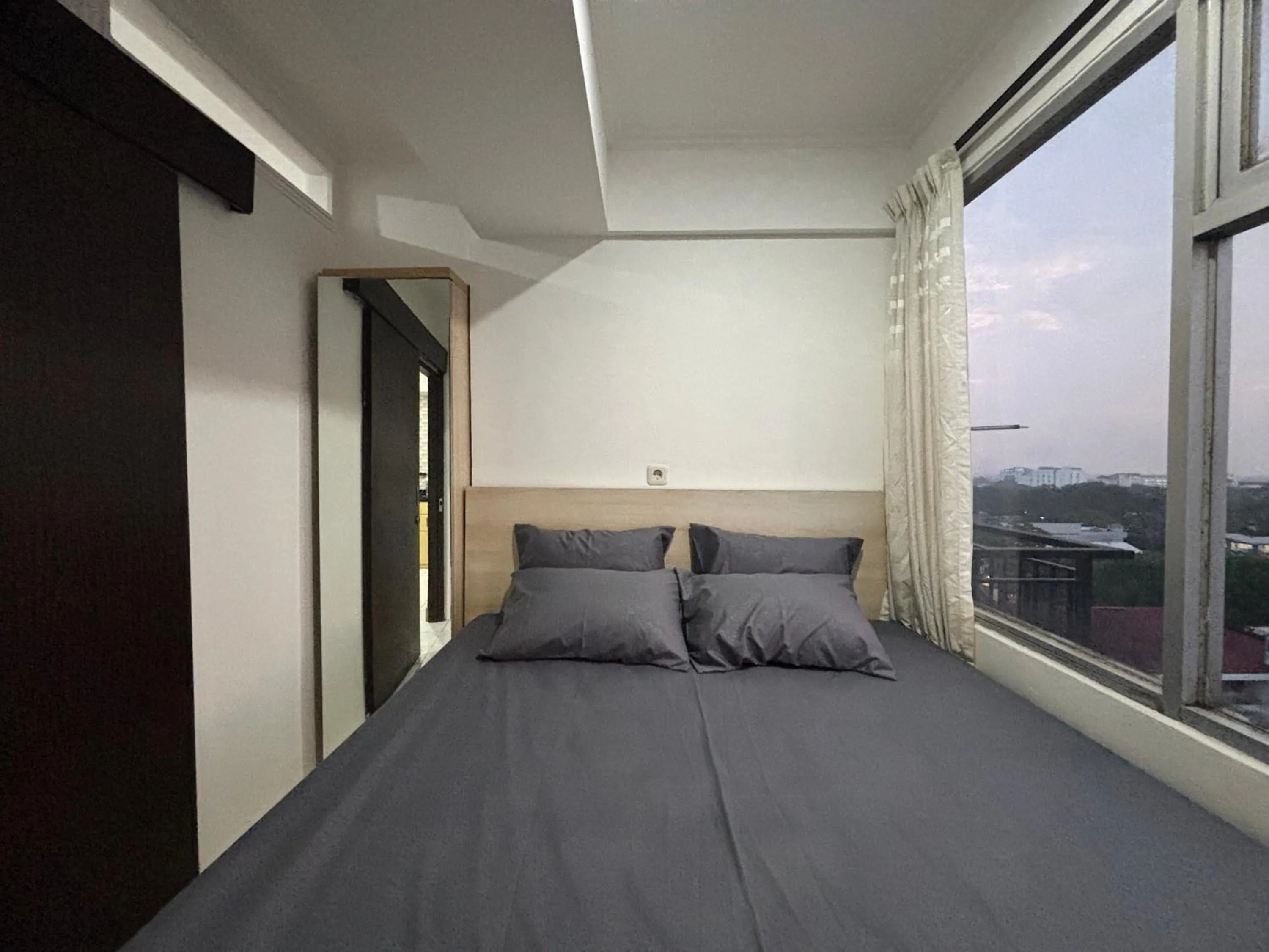 Bed in The Jarrdin Apartment Hotels by Ironman