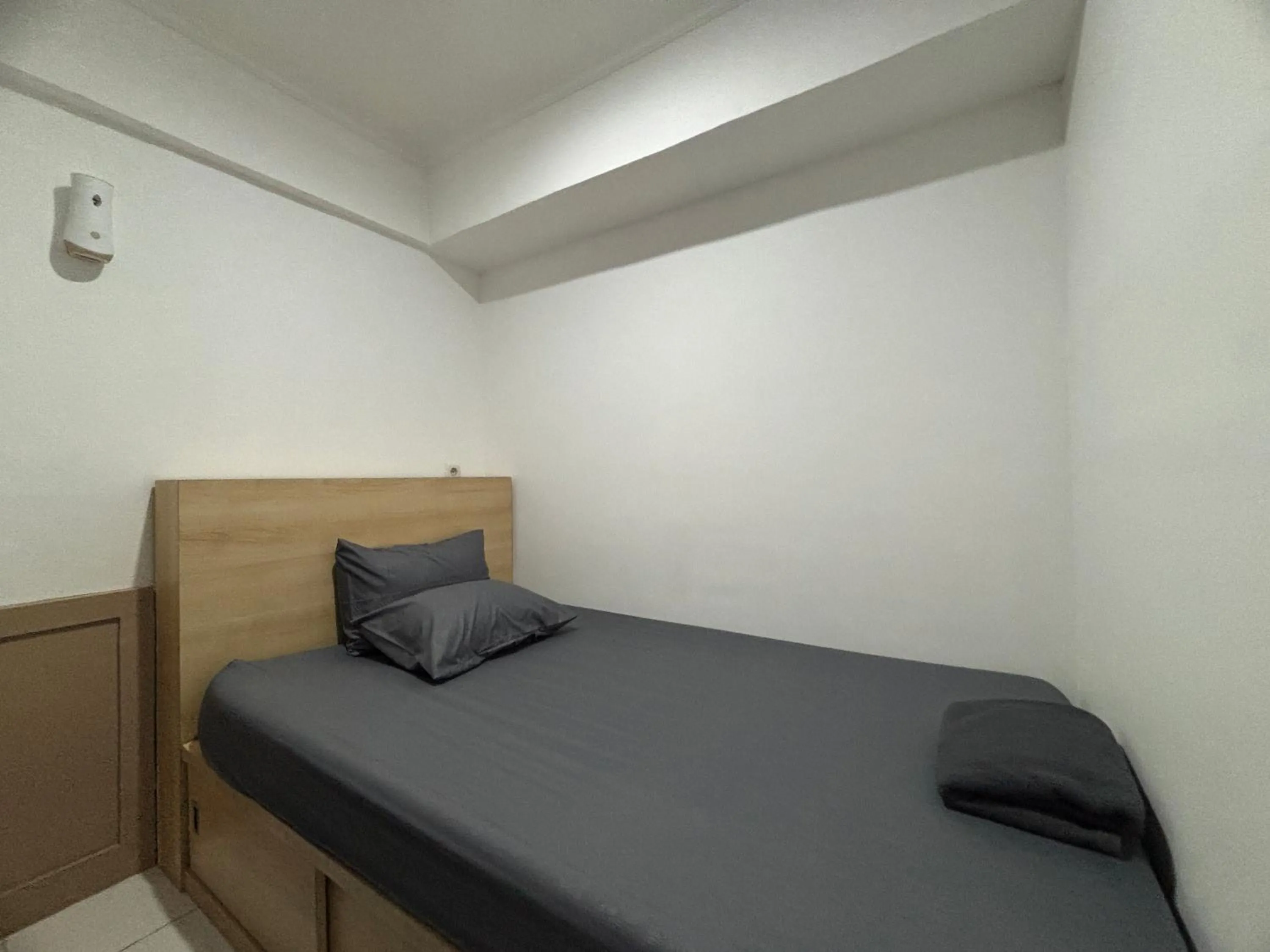 Bed in The Jarrdin Apartment Hotels by Ironman