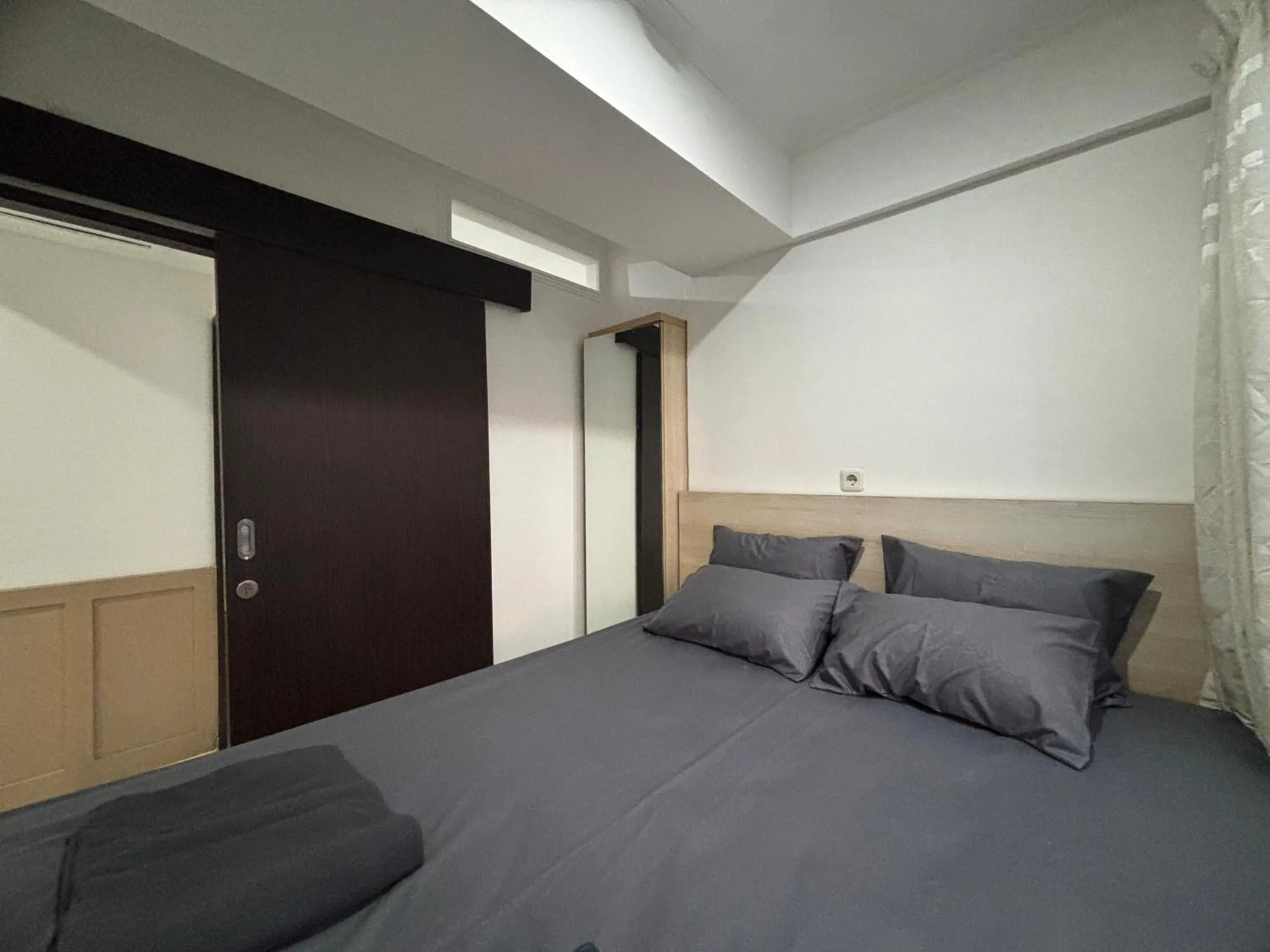 Bed in The Jarrdin Apartment Hotels by Ironman