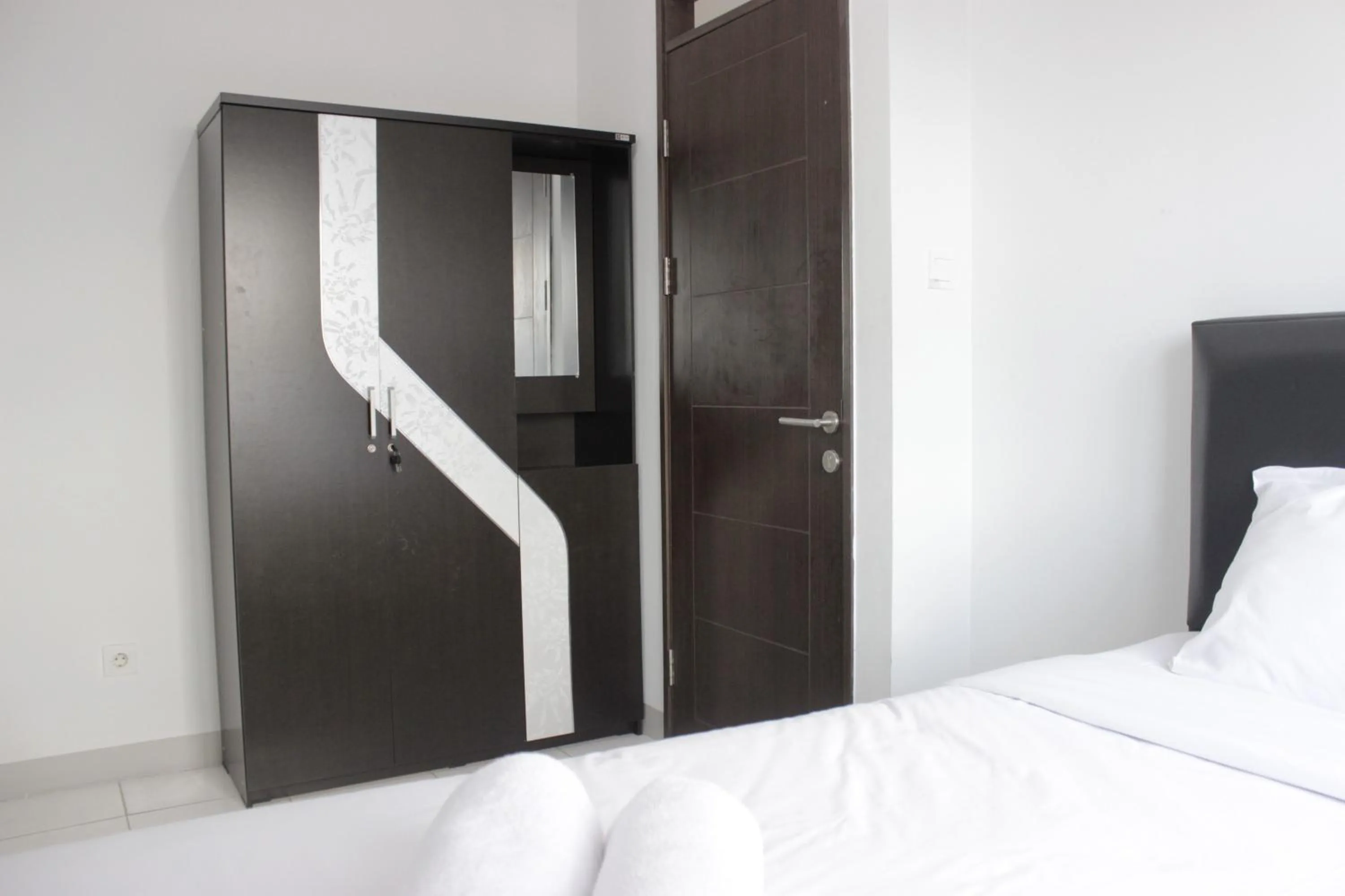 Bed in Comfy 2BR Apartment at Mekarwangi Square Cibaduyut By Travelio