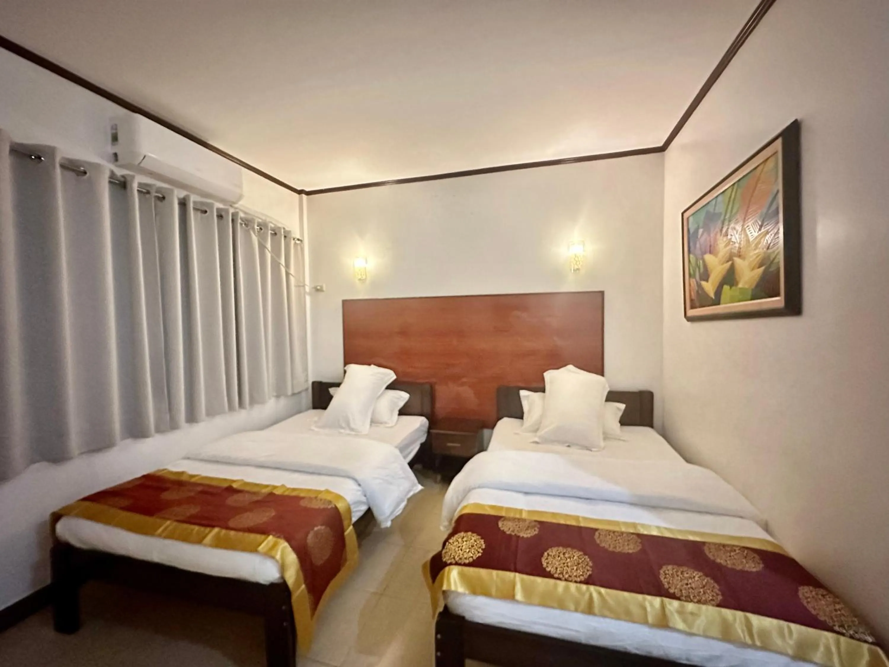 Bed in Gracey Dive Resort and Restaurant