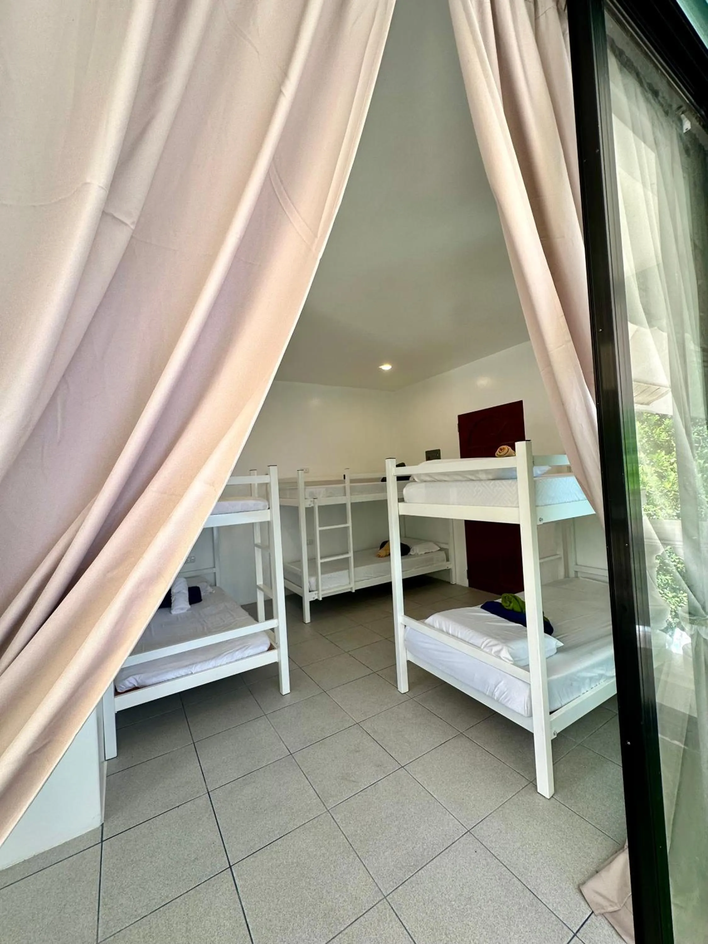 Bed in Gracey Dive Resort and Restaurant