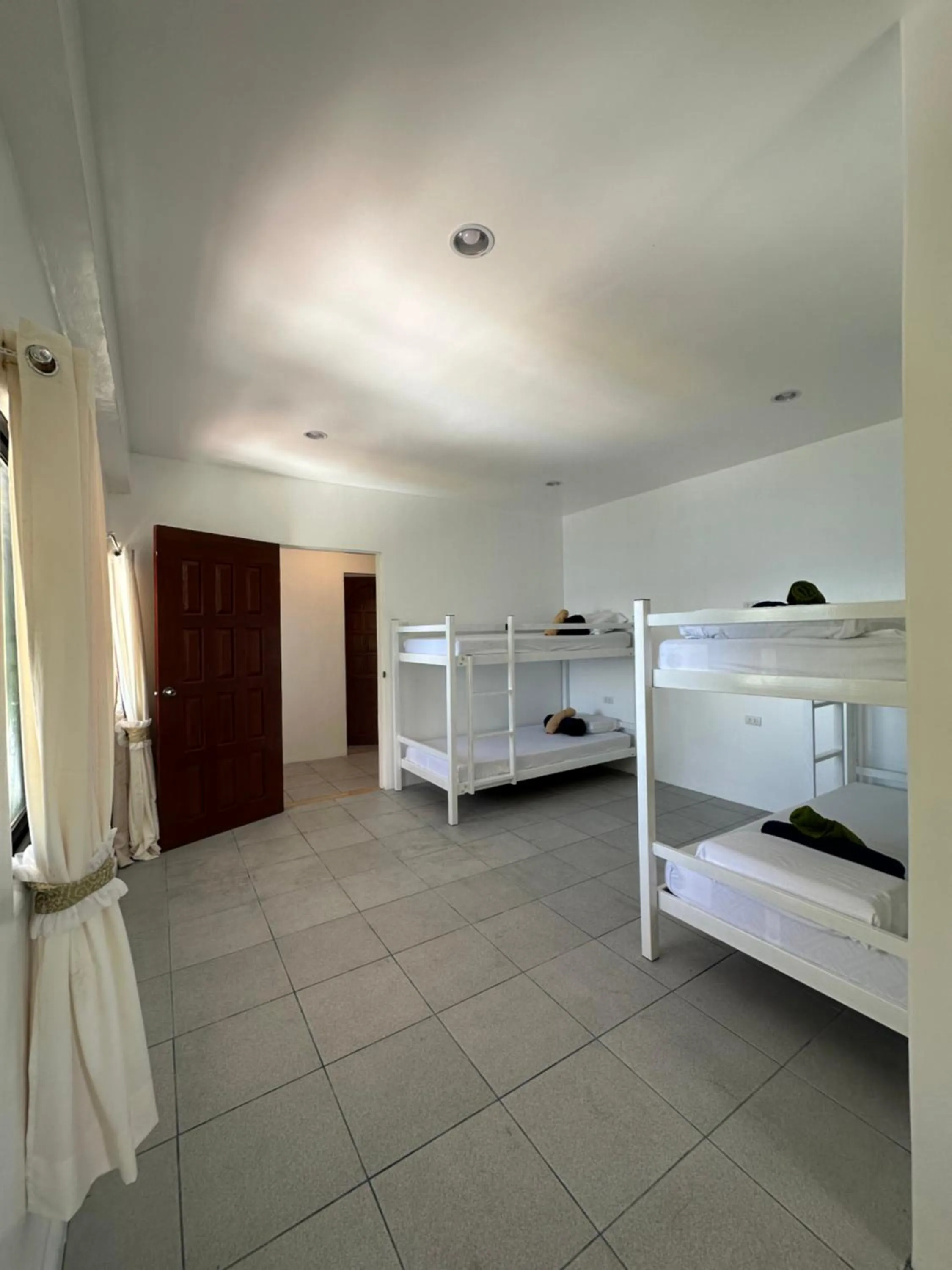 Bed in Gracey Dive Resort and Restaurant