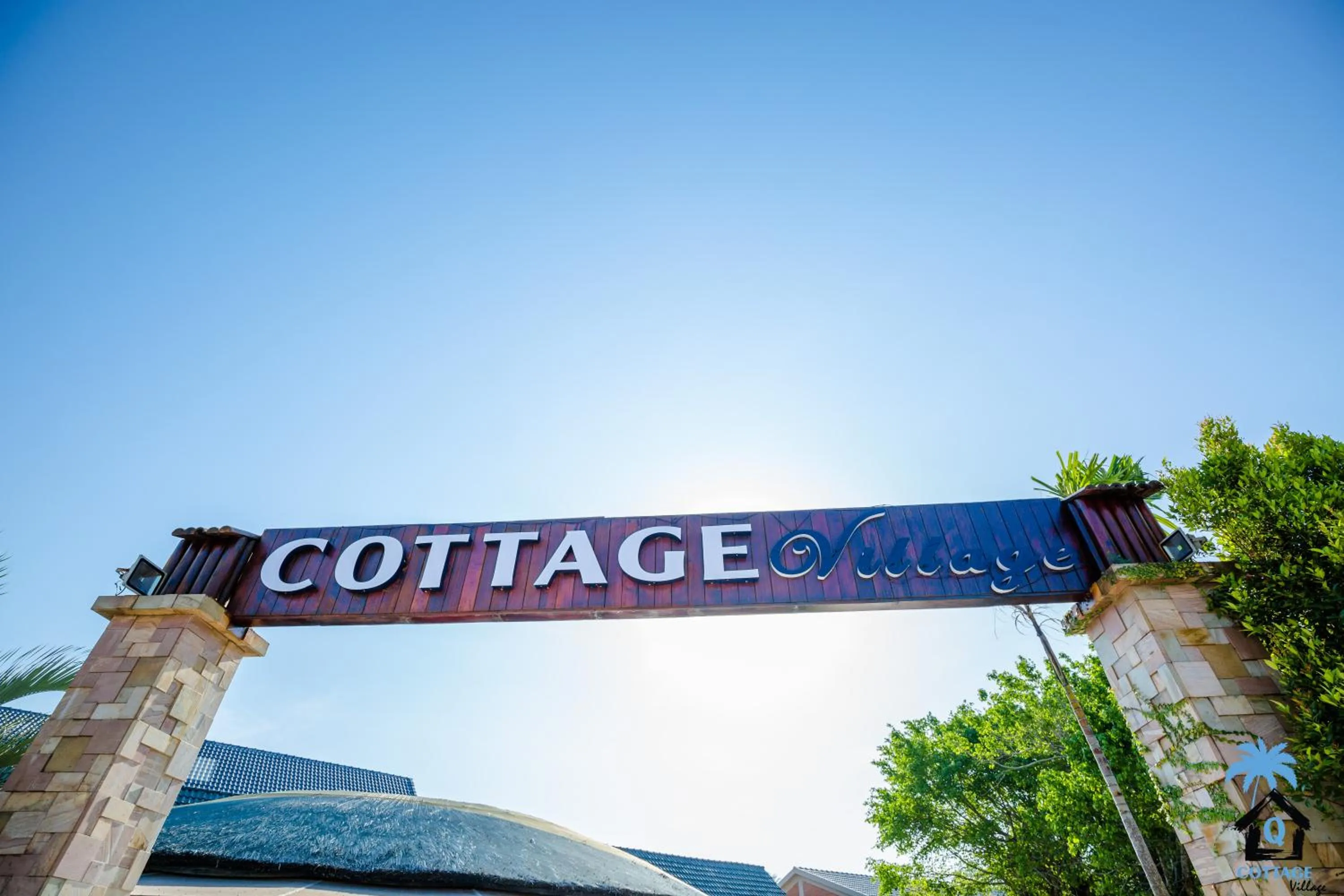 Property logo or sign in Cottage Village