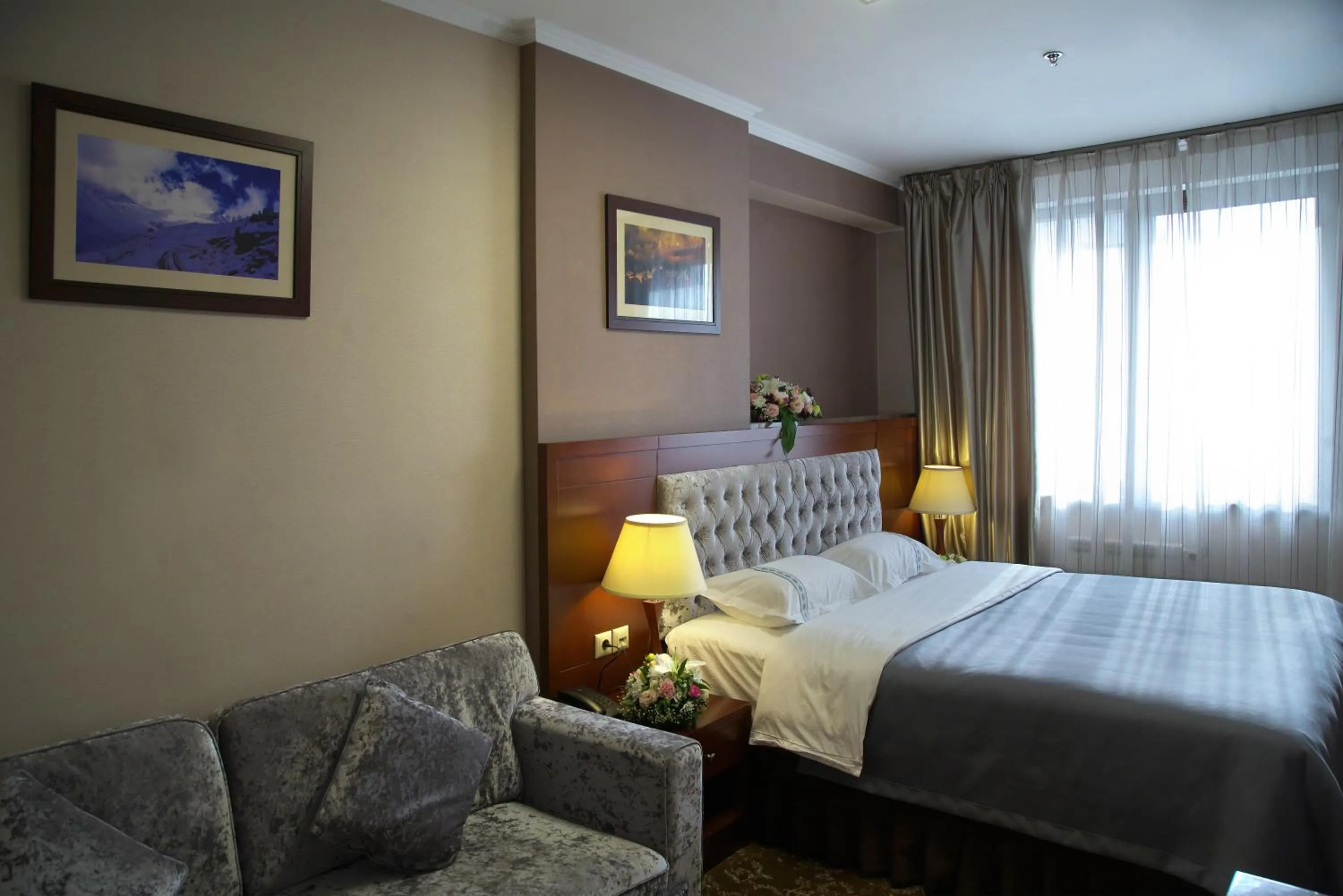 Seating area, Bed in Grand Voyage Hotel