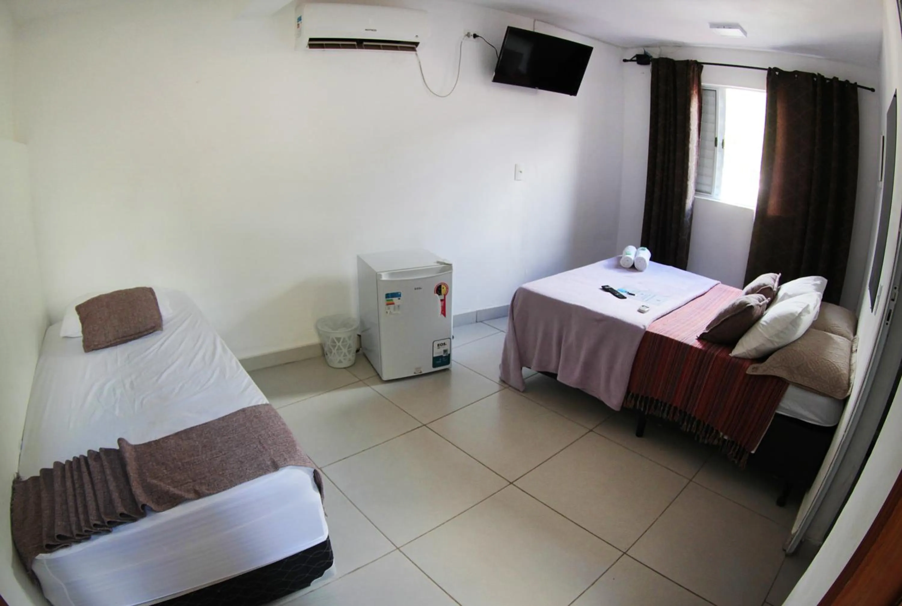 Bed in Pousada Sol e Mar