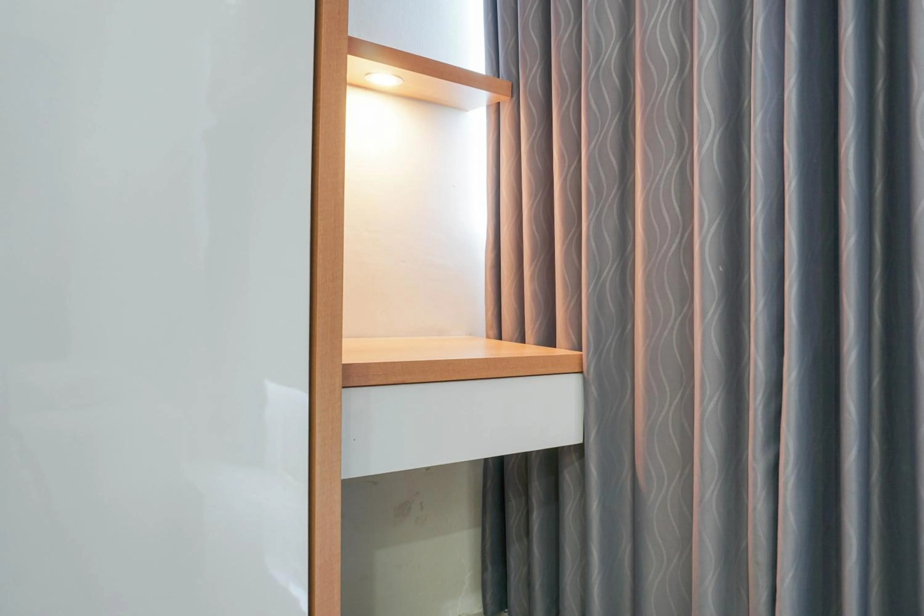 Bedroom in Fully Furnished with Comfortable Design 2BR Harco Mangga Besar Apartment By Travelio