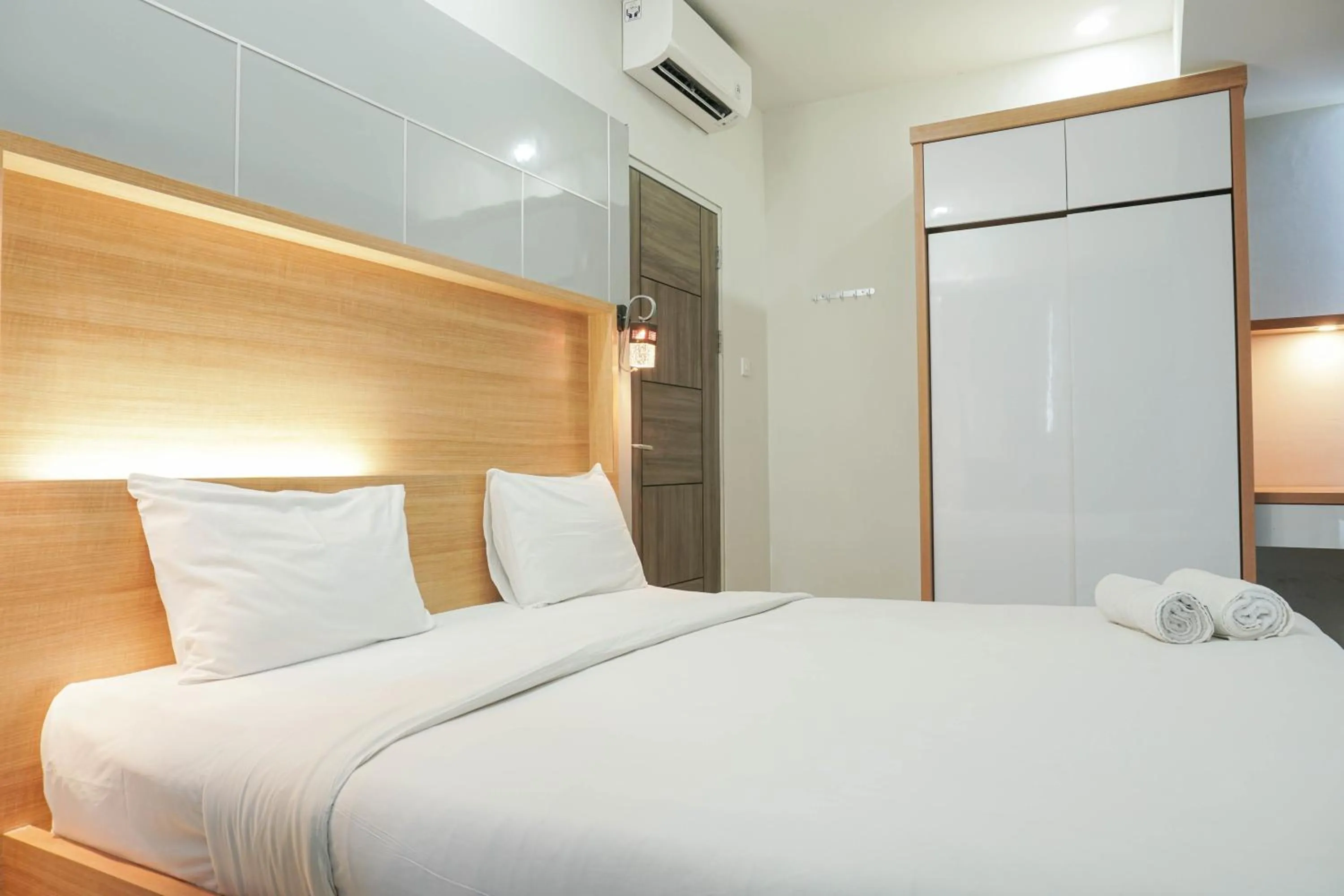 Bed in Fully Furnished with Comfortable Design 2BR Harco Mangga Besar Apartment By Travelio