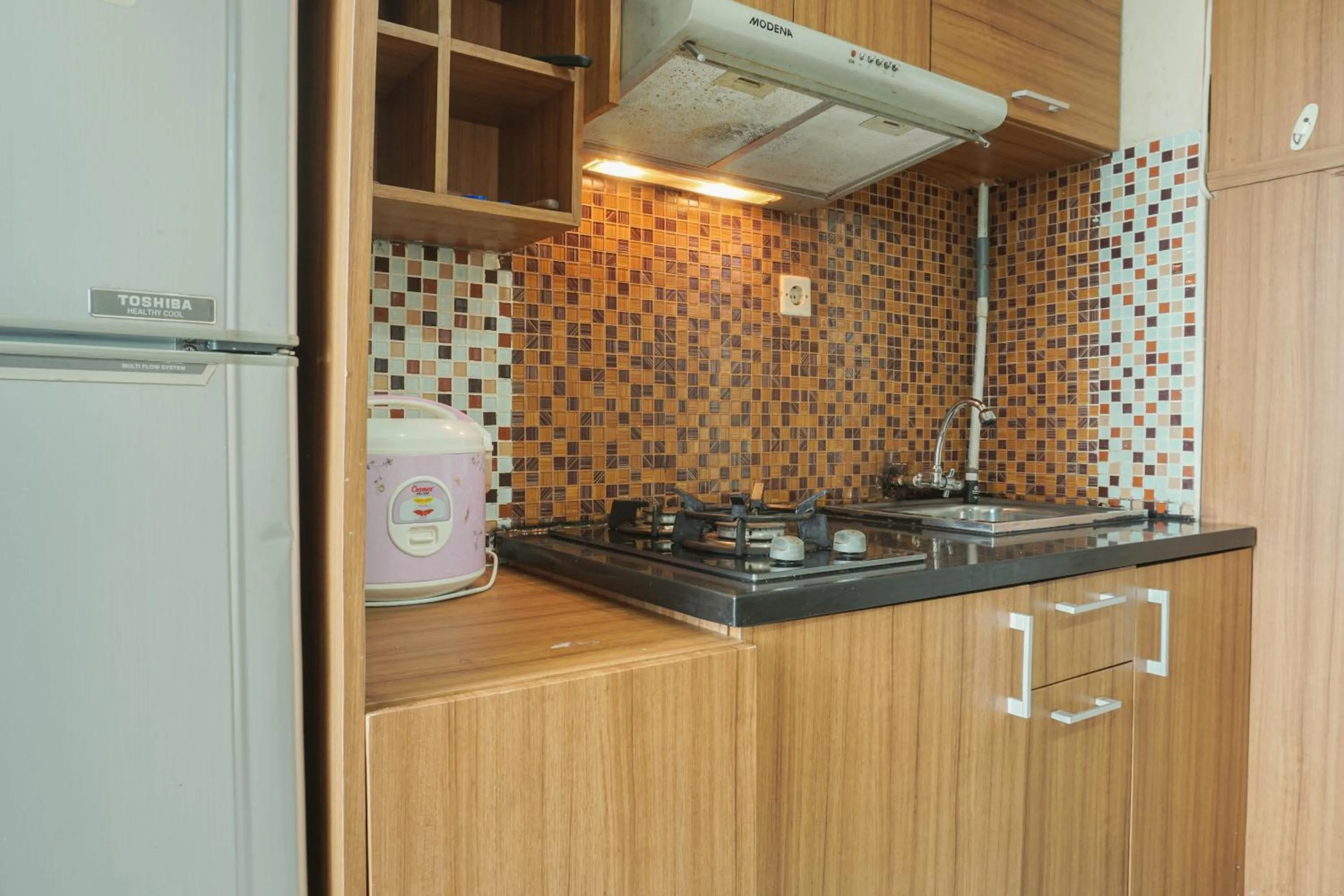Kitchen or kitchenette in Comfy and Strategic 2BR at Menteng Square Apartment By Travelio