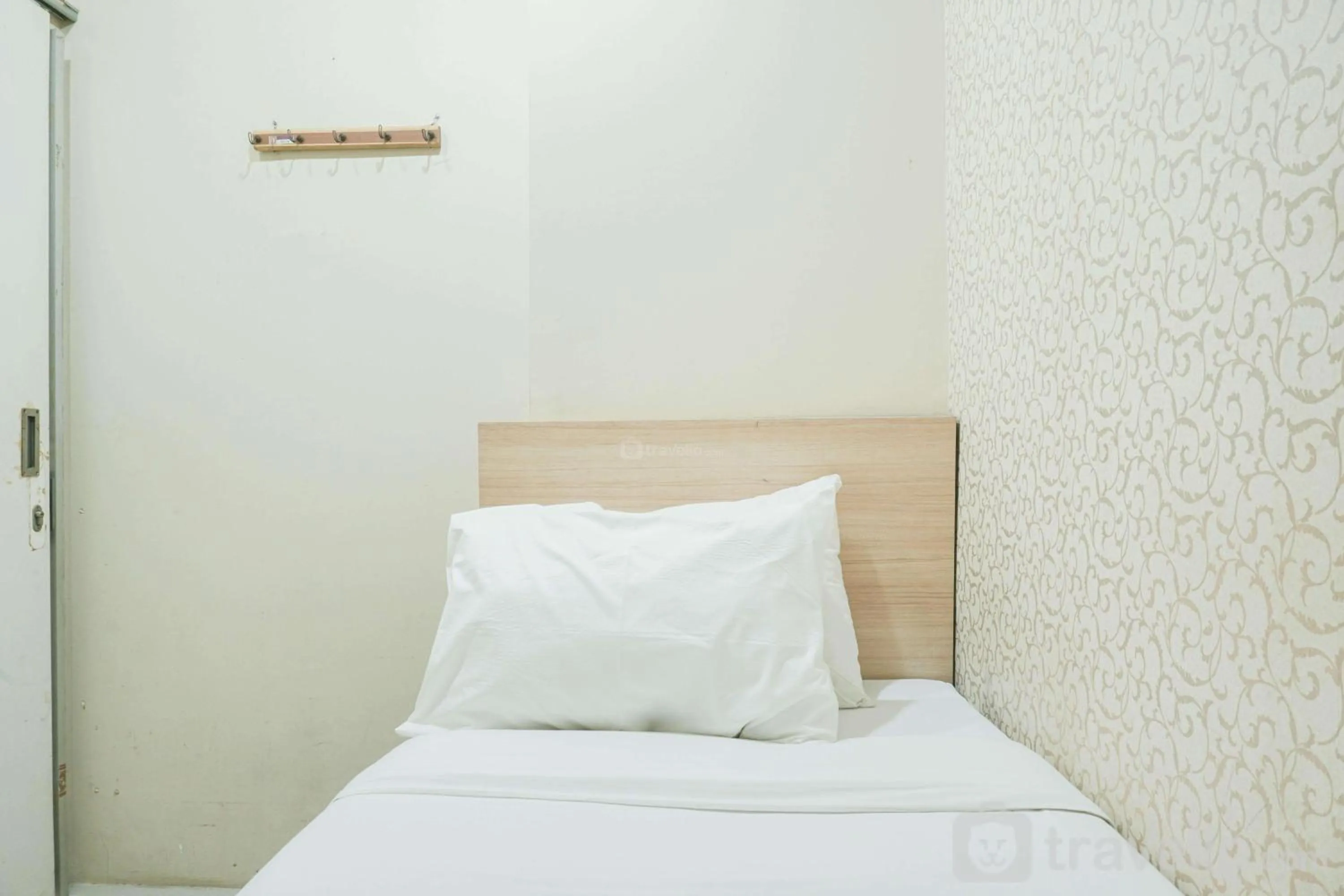 Bed in Comfy and Strategic 2BR at Menteng Square Apartment By Travelio