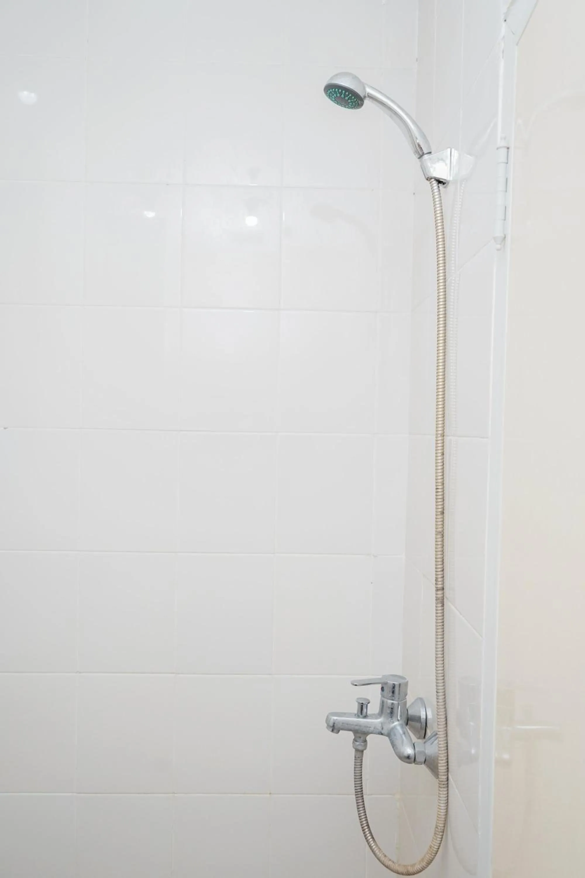 Bathroom in Homey and Comfact Studio at Medina Apartment By Travelio