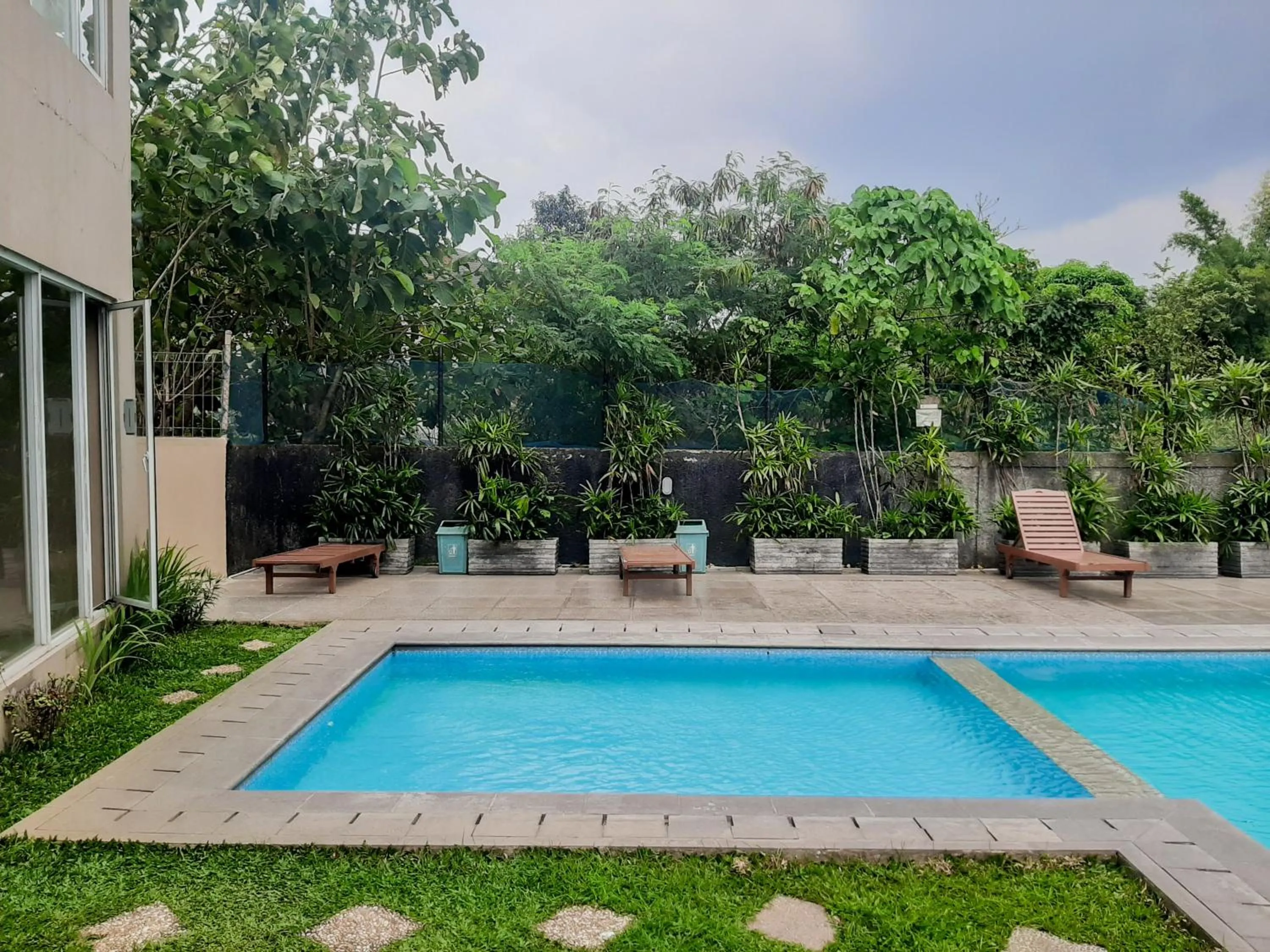 Property building in Homey and Comfact Studio at Medina Apartment By Travelio