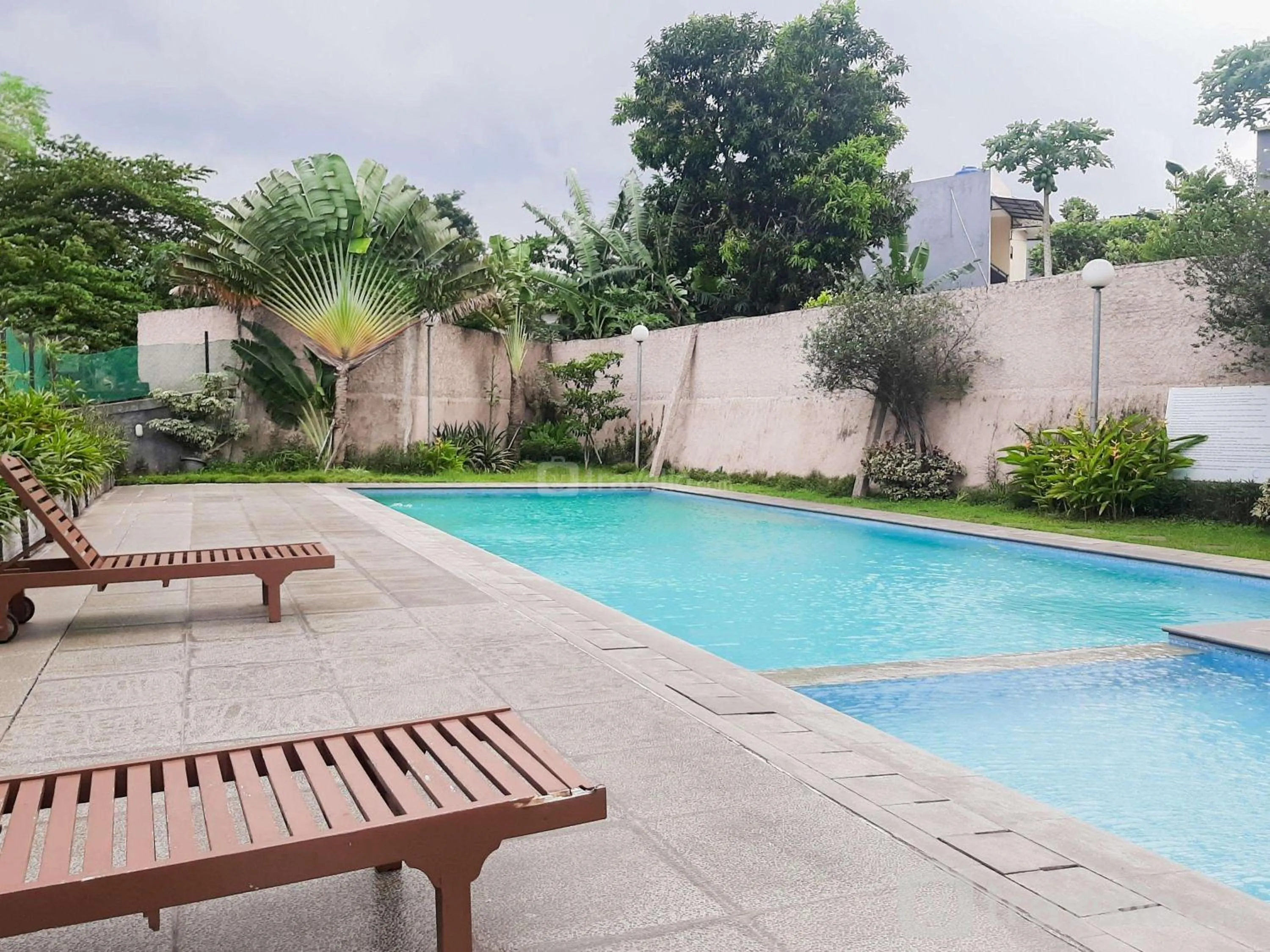 Swimming pool in Homey and Comfact Studio at Medina Apartment By Travelio