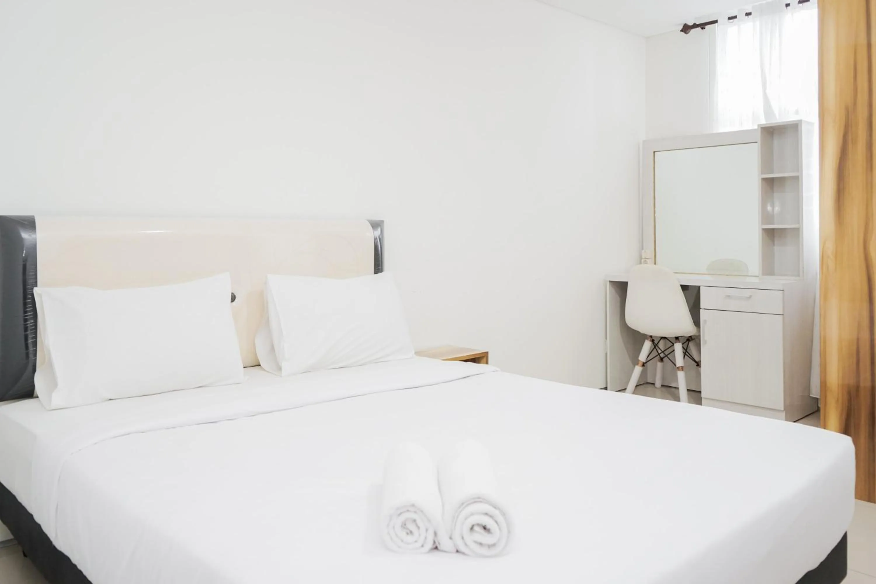 Bed in Functional Studio Apartment at Tuscany Residences BSD City By Travelio