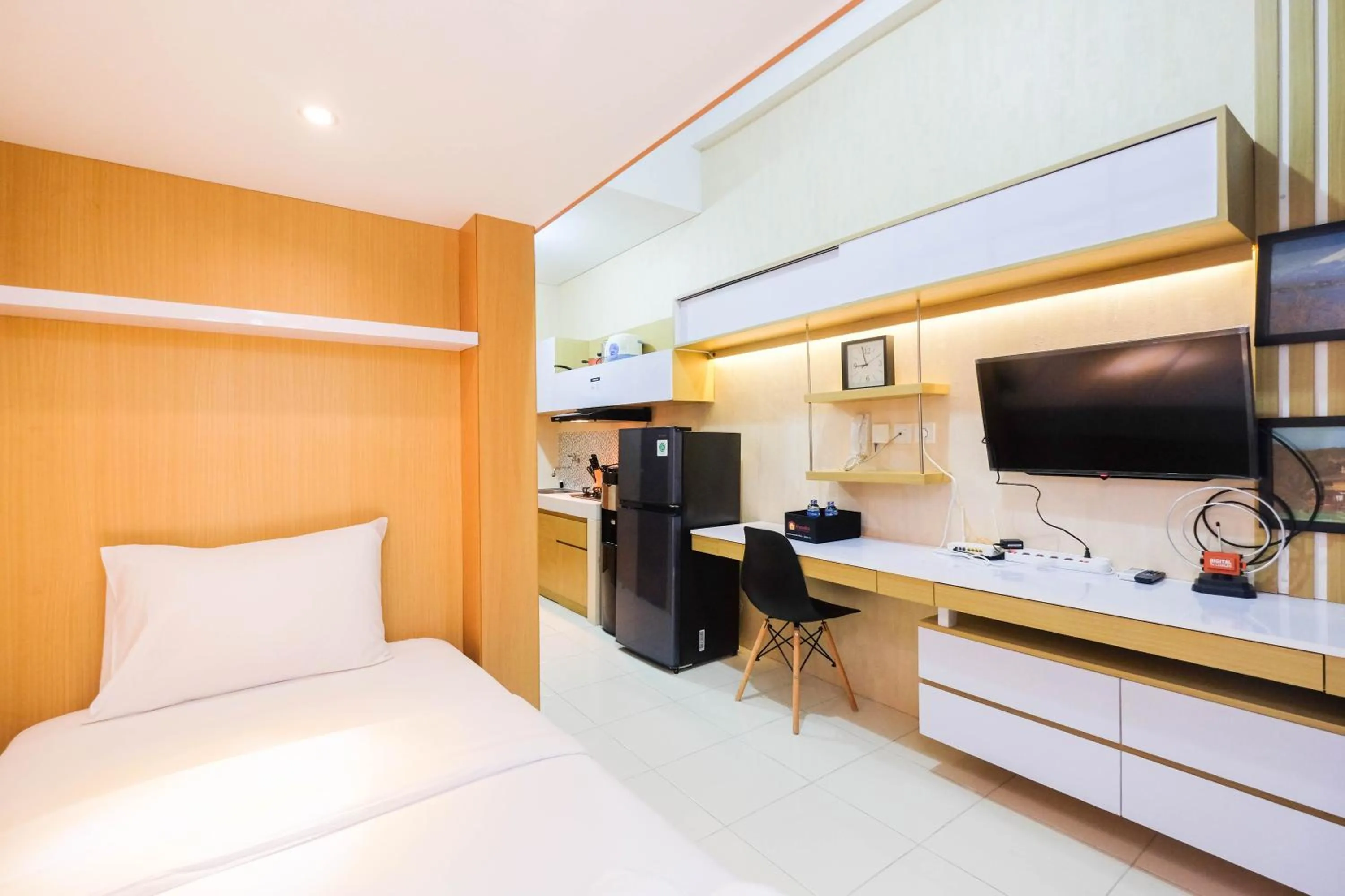 Bed in Fully Furnished Studio with Comfortable Design Dave Apartment By Travelio
