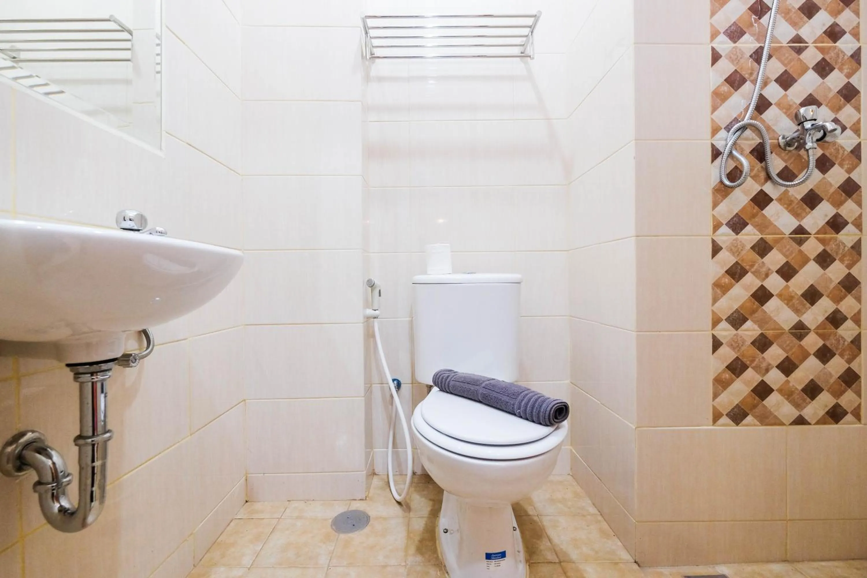 Bathroom in Fully Furnished Studio with Comfortable Design Dave Apartment By Travelio