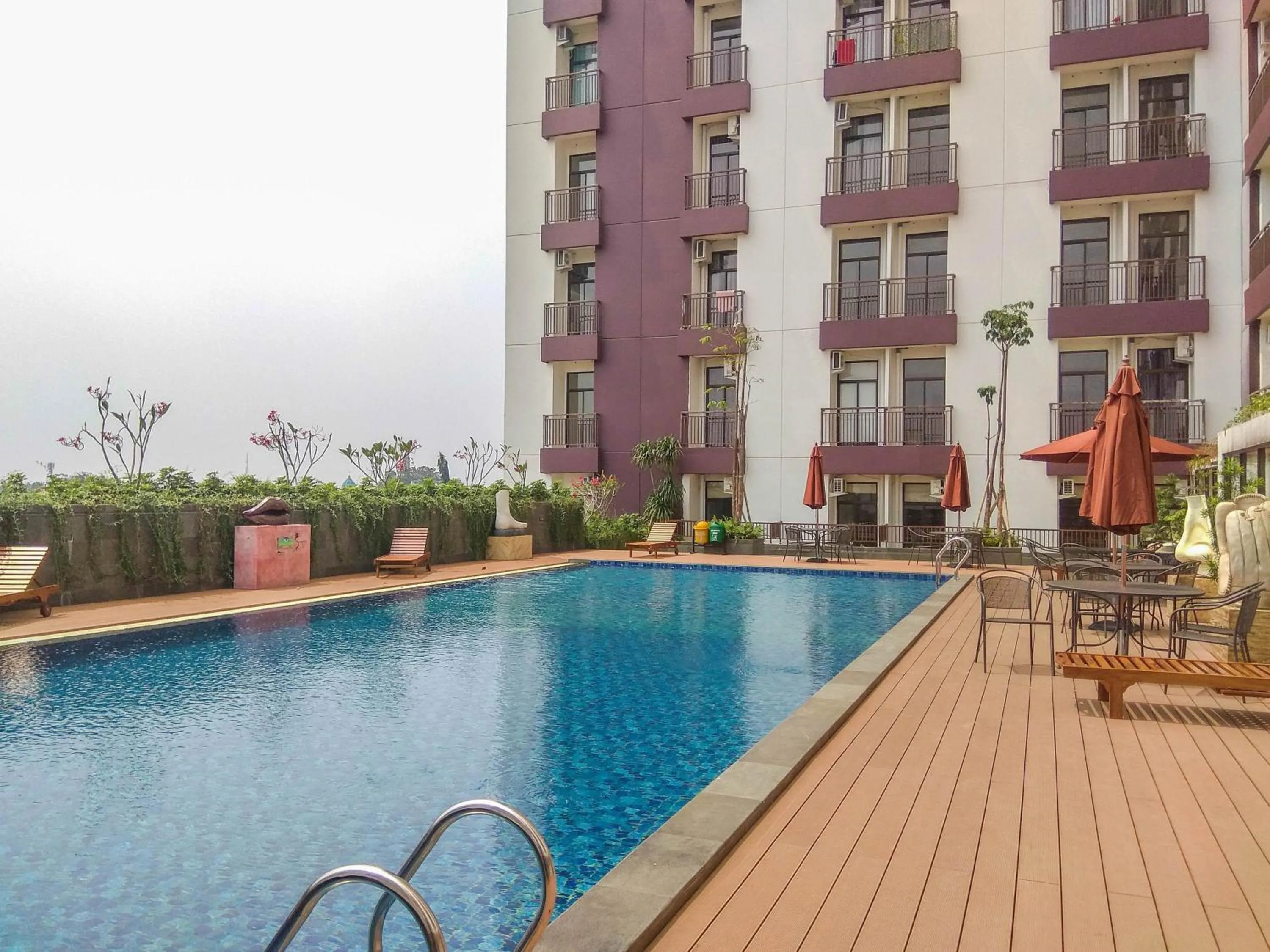 Swimming pool in Fully Furnished Studio with Comfortable Design Dave Apartment By Travelio