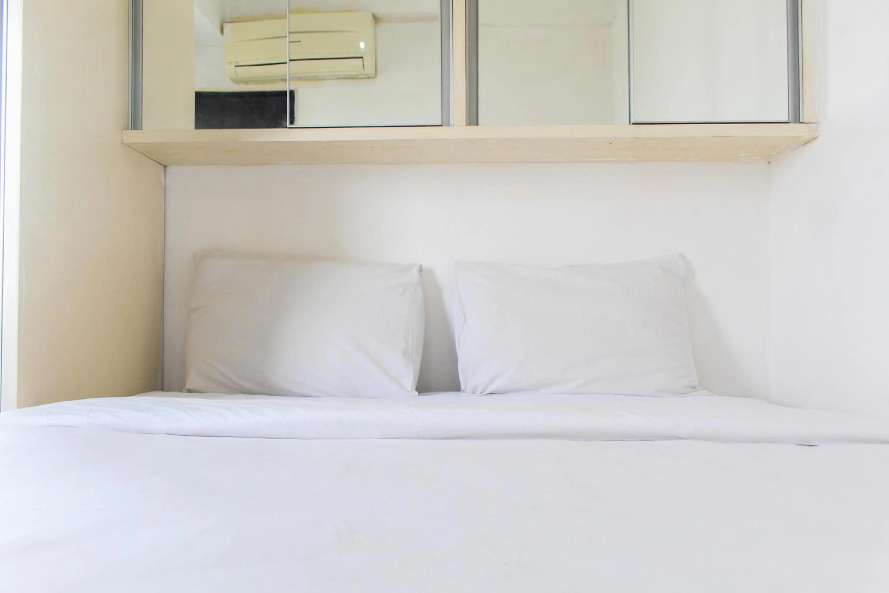 Bed in Best Price 1BR with Extra Room at Menara Latumenten Apartment Grogol By Travelio