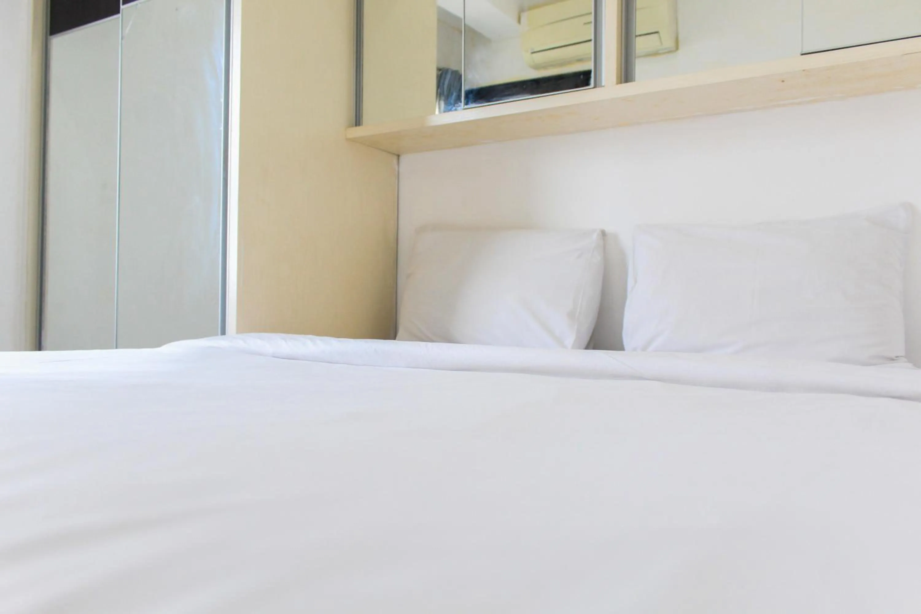 Bed in Best Price 1BR with Extra Room at Menara Latumenten Apartment Grogol By Travelio