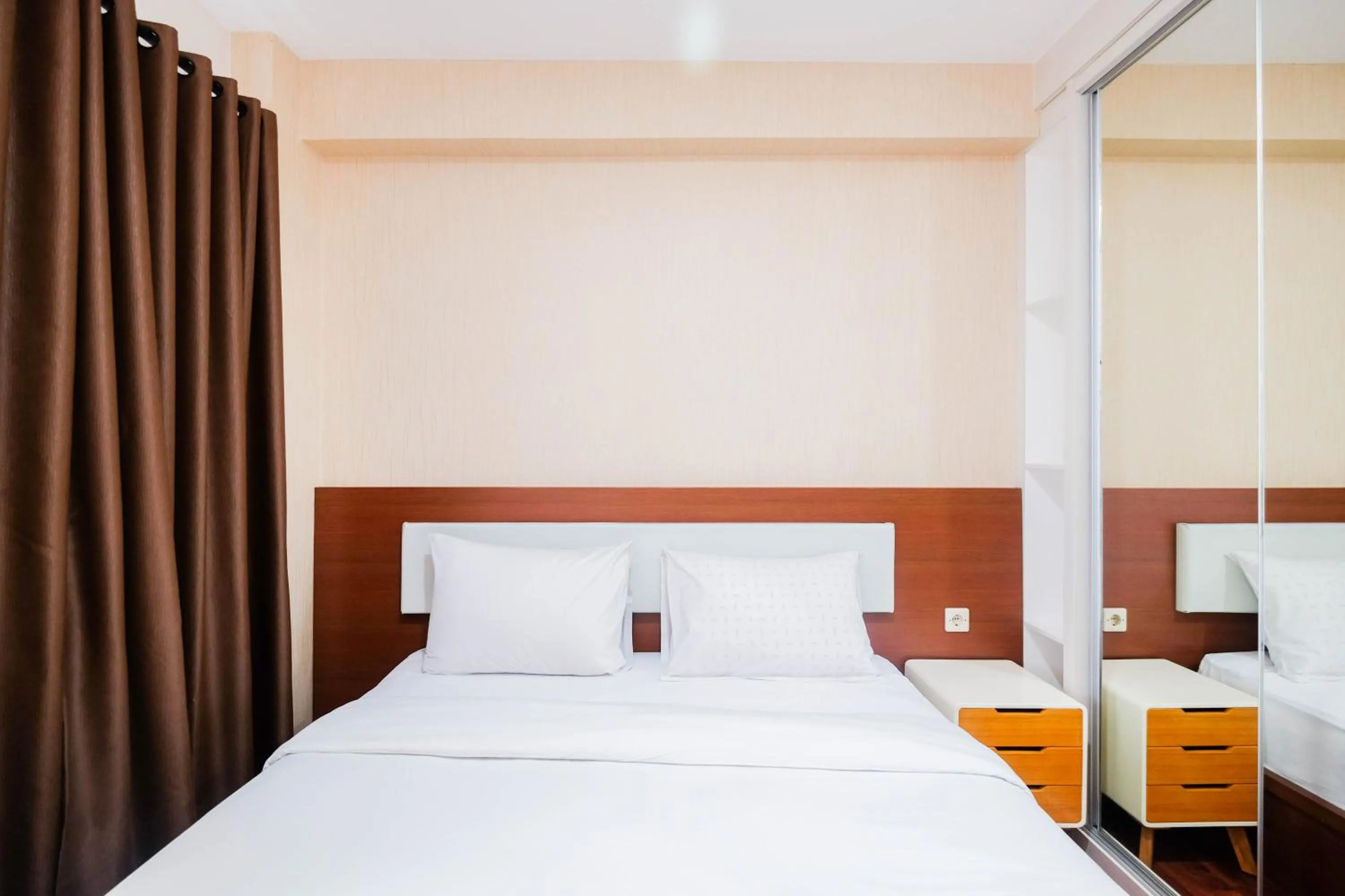 Bed in Cozy and Simply Studio Tifolia Apartment near Kelapa Gading By Travelio