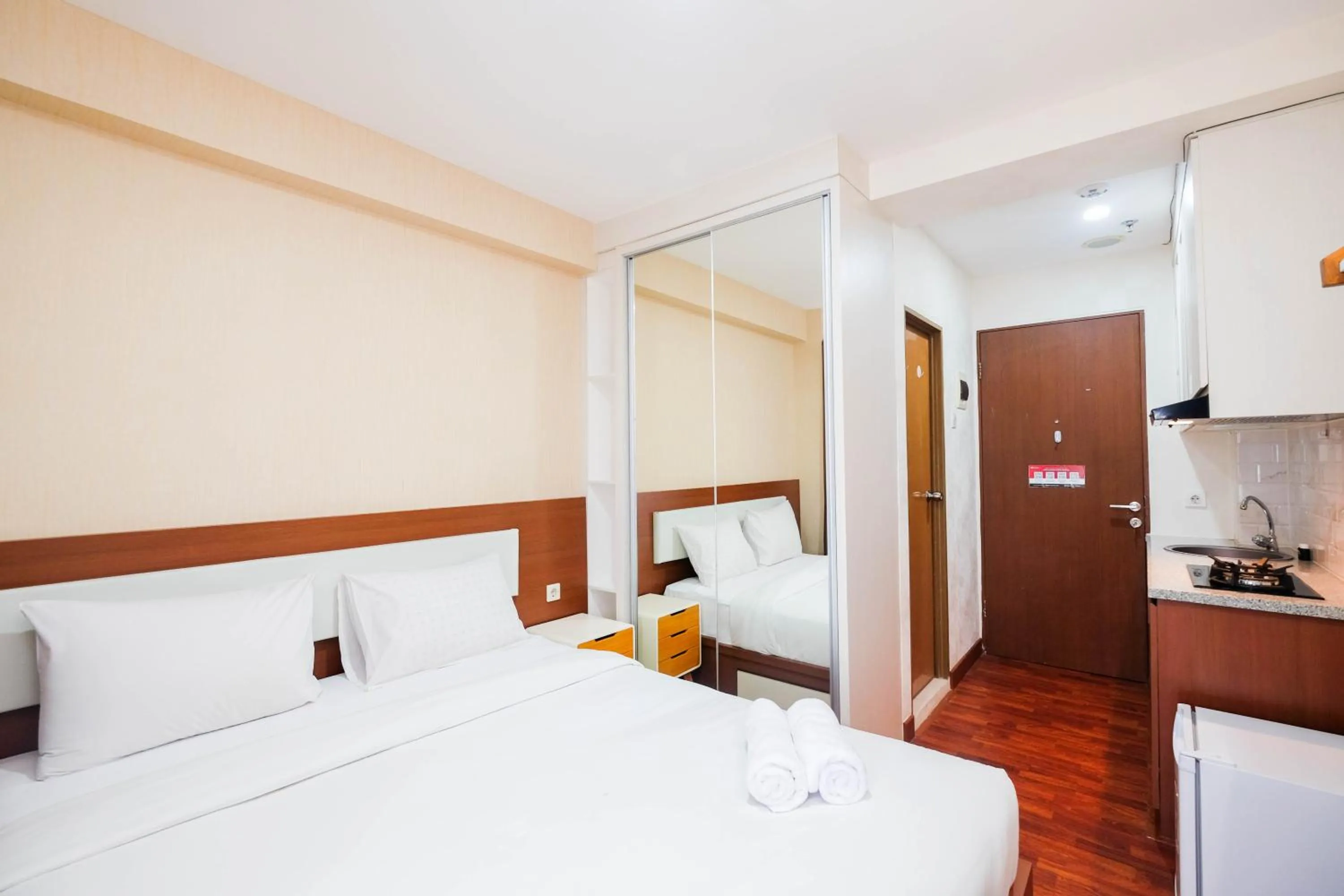 Bed in Cozy and Simply Studio Tifolia Apartment near Kelapa Gading By Travelio