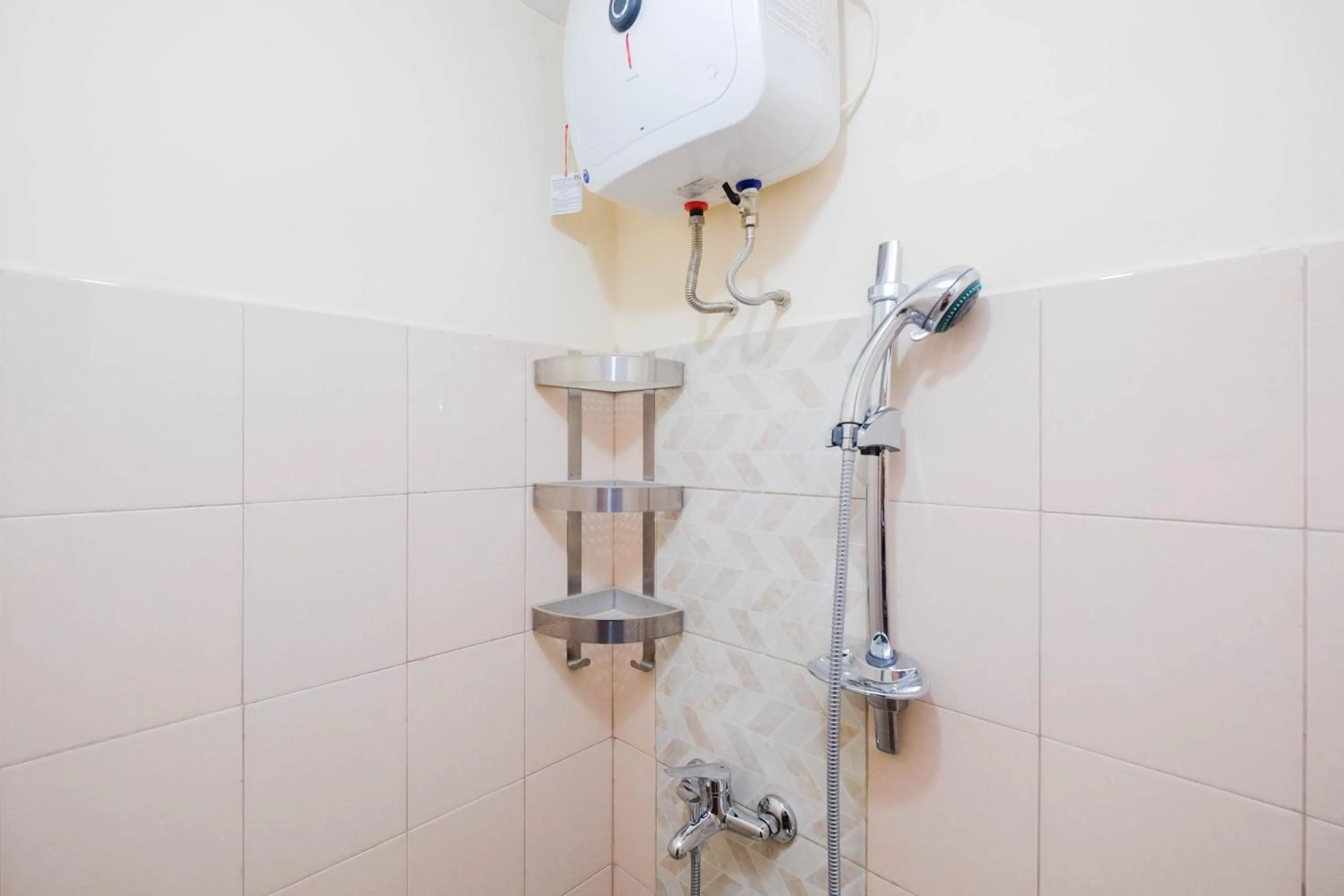 Bathroom in Cozy and Simply Studio Tifolia Apartment near Kelapa Gading By Travelio