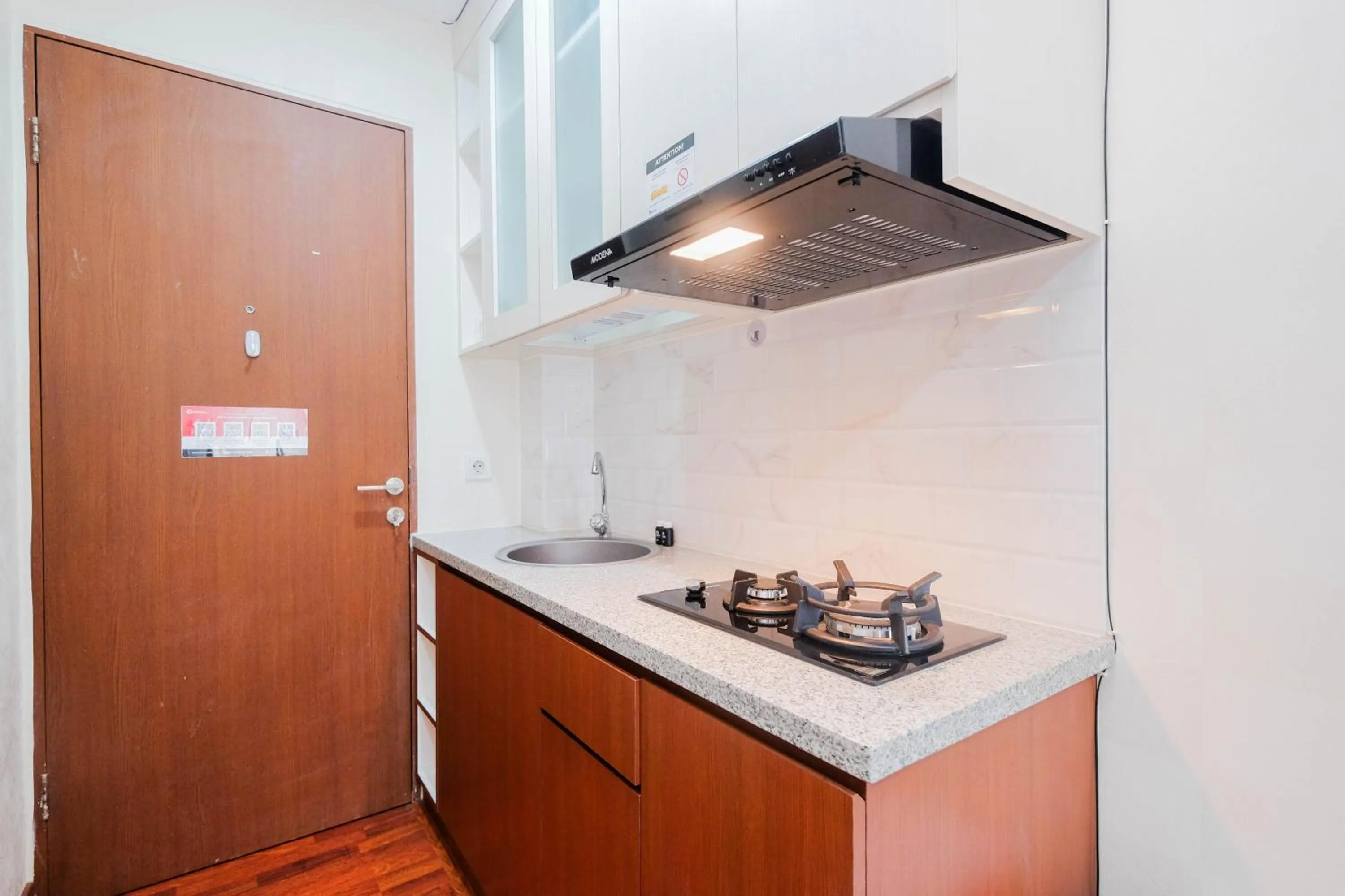 Kitchen or kitchenette in Cozy and Simply Studio Tifolia Apartment near Kelapa Gading By Travelio