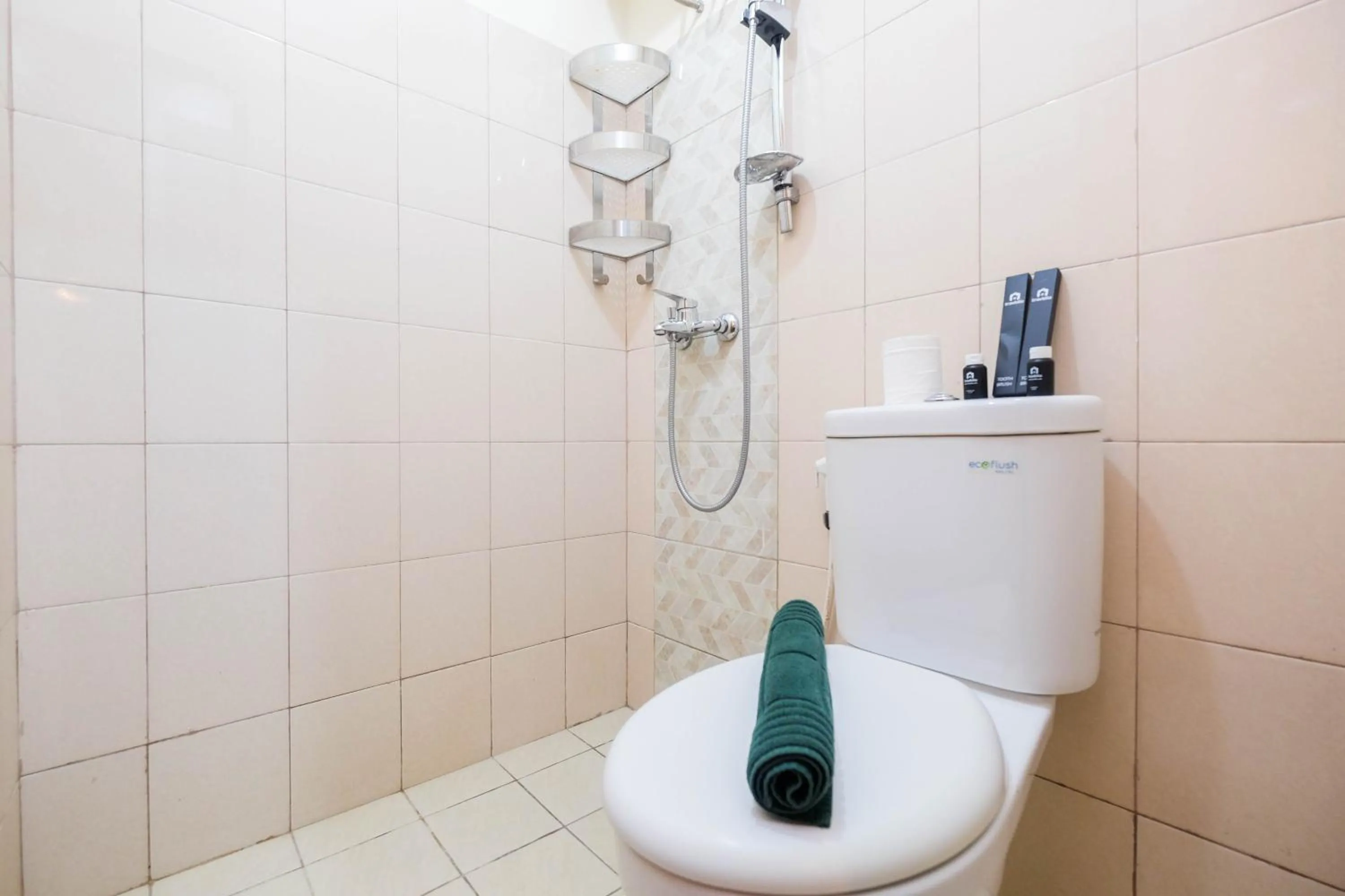 Bathroom in Cozy and Simply Studio Tifolia Apartment near Kelapa Gading By Travelio