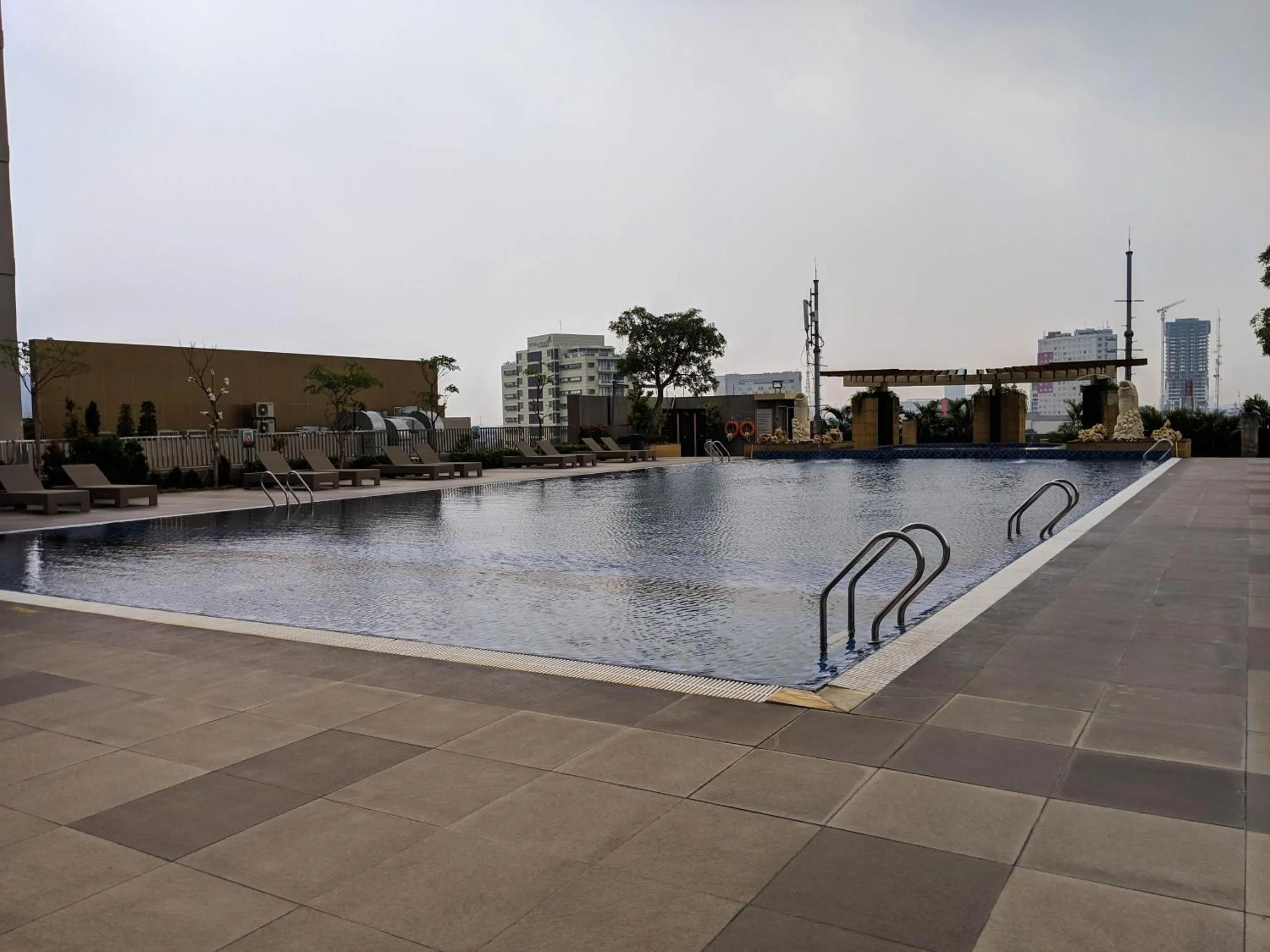 Swimming pool in Scenic Modern 2BR Apartment at Trillium Residence By Travelio