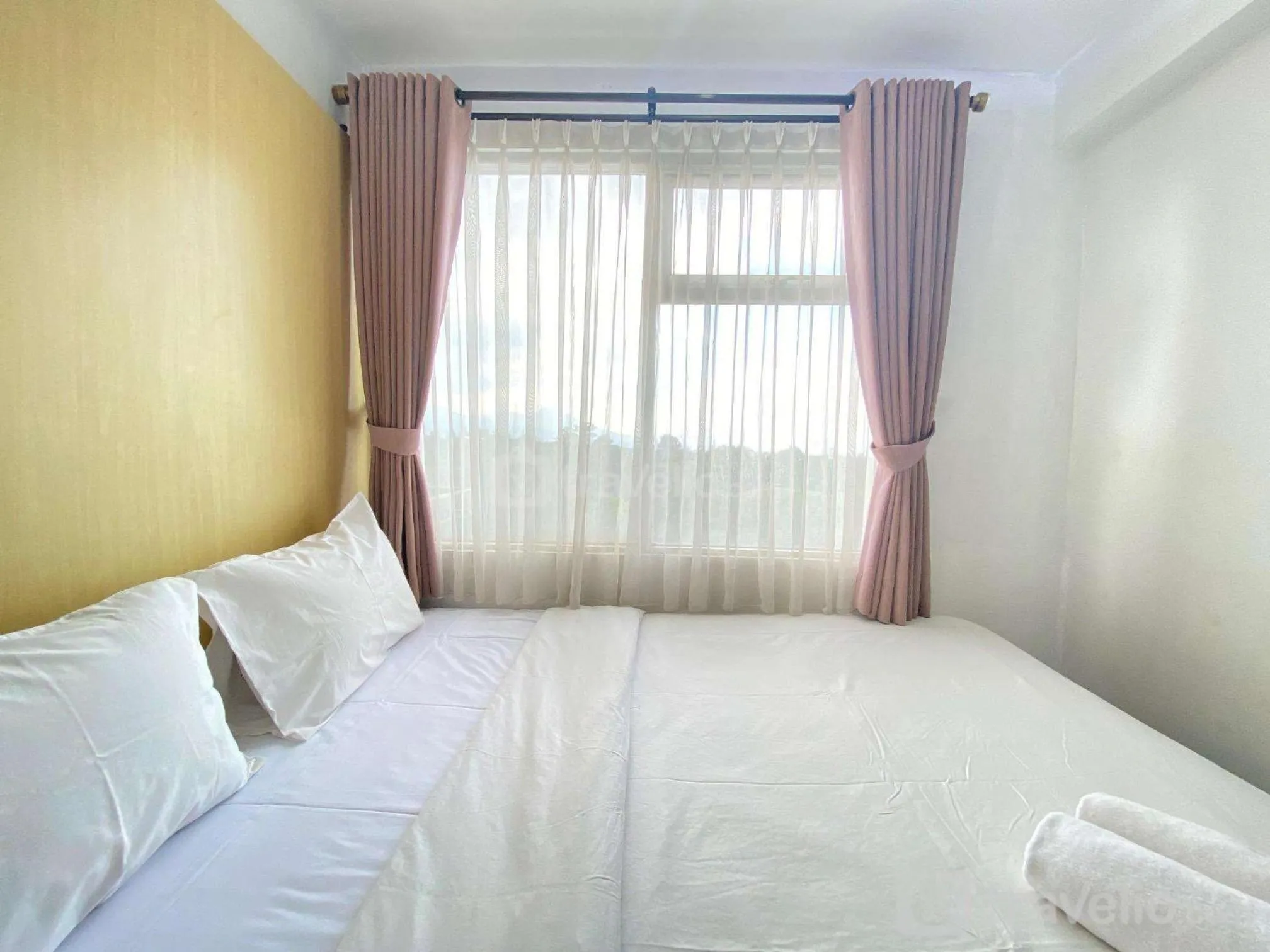 Bed in Quite 2BR Apartment AC in Living Room at The Jarrdin Cihampelas By Travelio