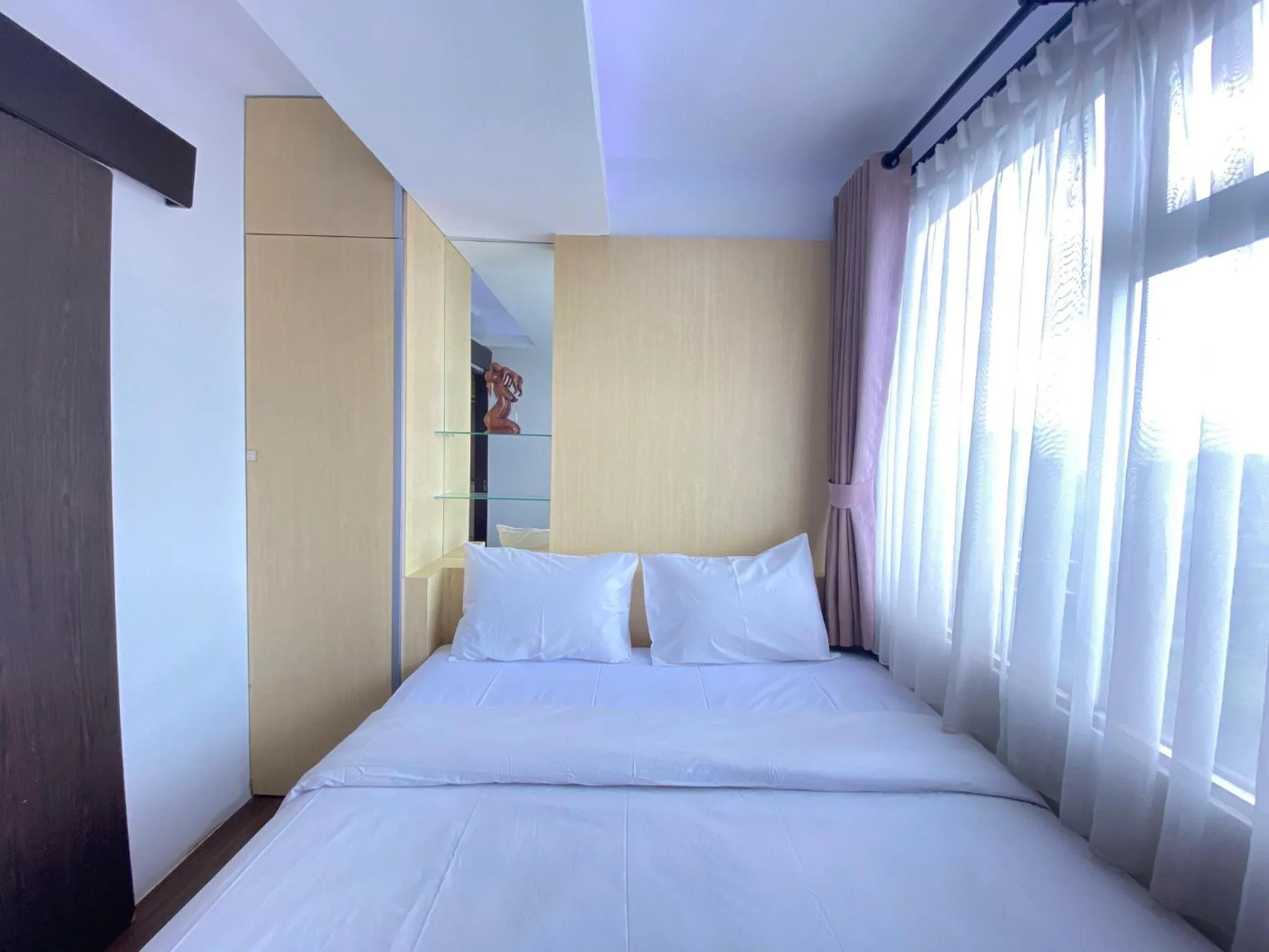 Bed in Quite 2BR Apartment AC in Living Room at The Jarrdin Cihampelas By Travelio