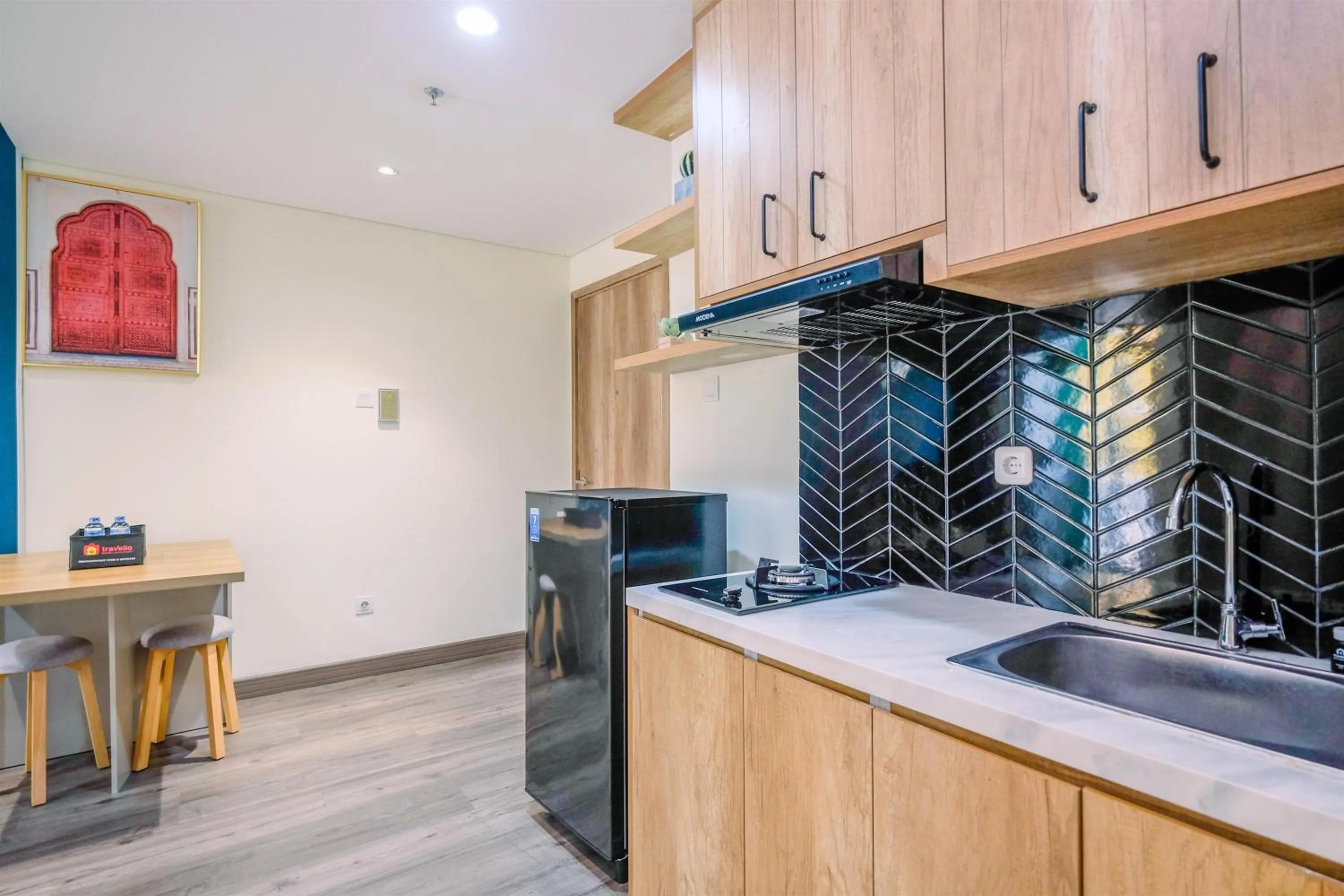 Kitchen or kitchenette in Simply 1BR Apartment at Pejaten Park Residence By Travelio