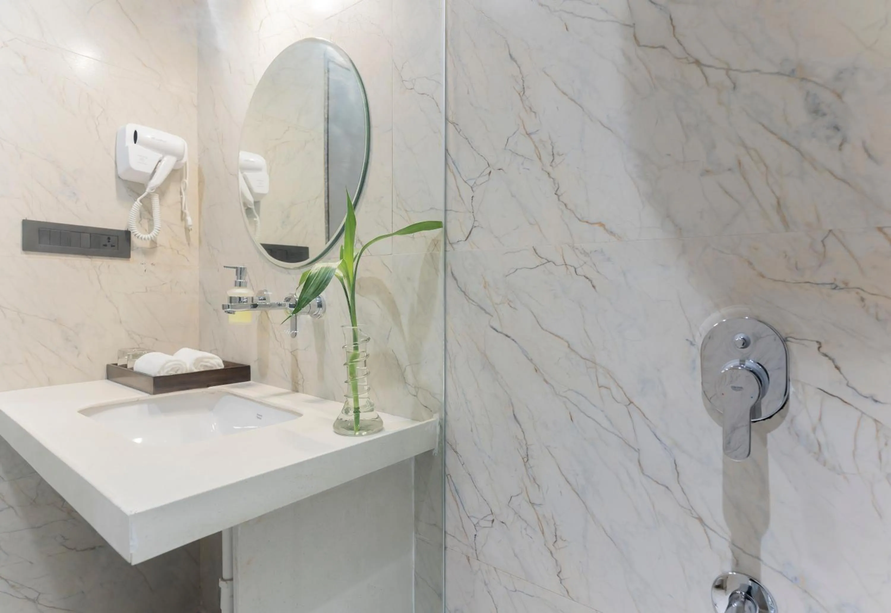 Shower in The Belita Hotel & Spa