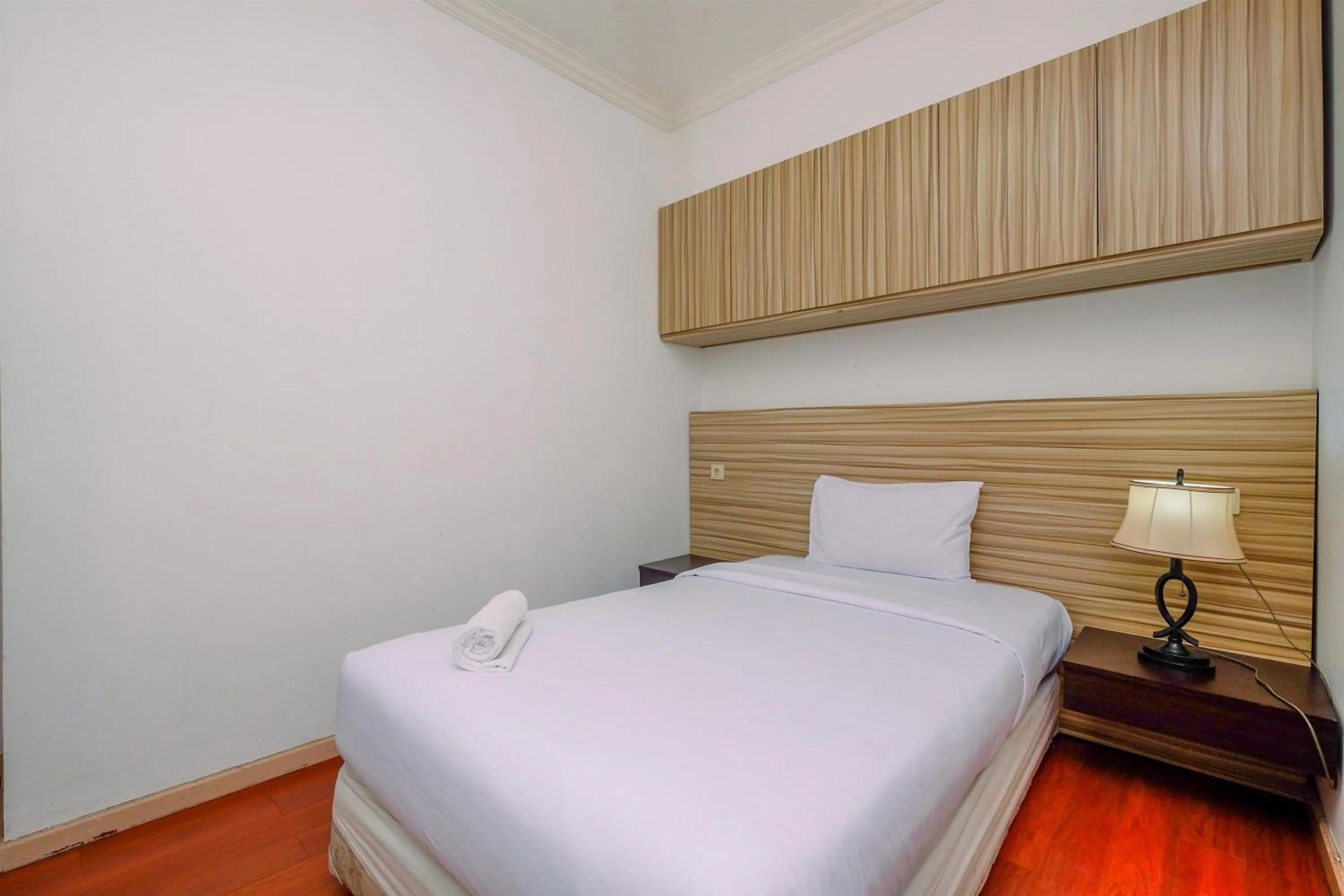 Bedroom, Bed in Comfort 2BR + Extra Room at Sudirman Tower Condominium Apartment By Travelio