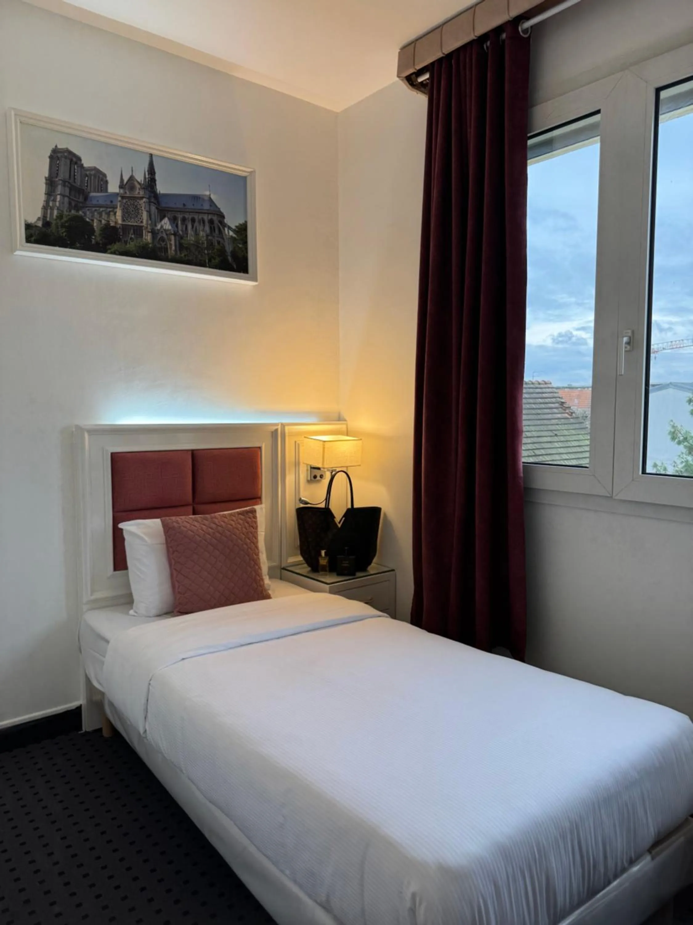 Bed in Hotel Grand Paris