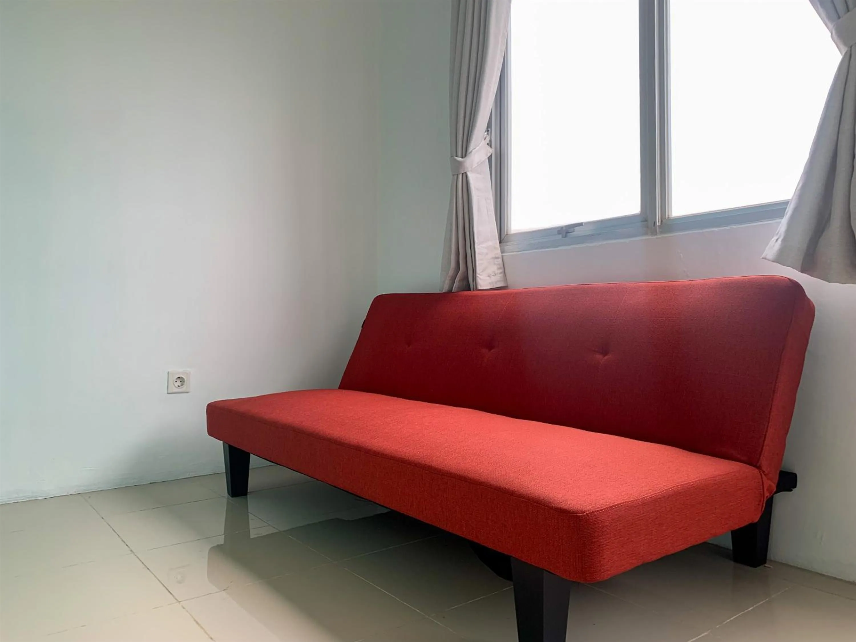 Living room in Cozy Studio at Park View Condominium Apartment By Travelio