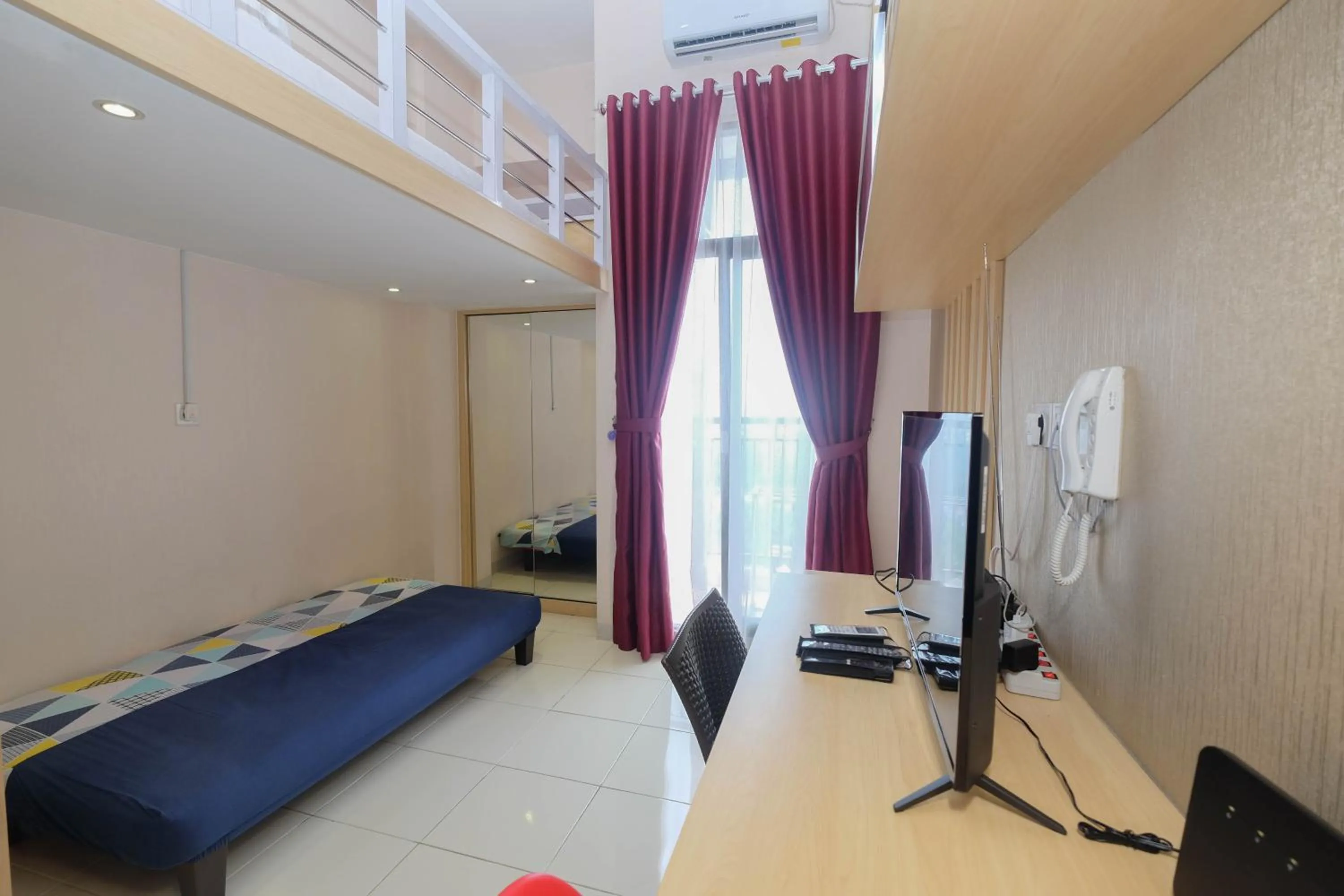 Bed in Comfy and Tidy Studio at Dave Apartment By Travelio