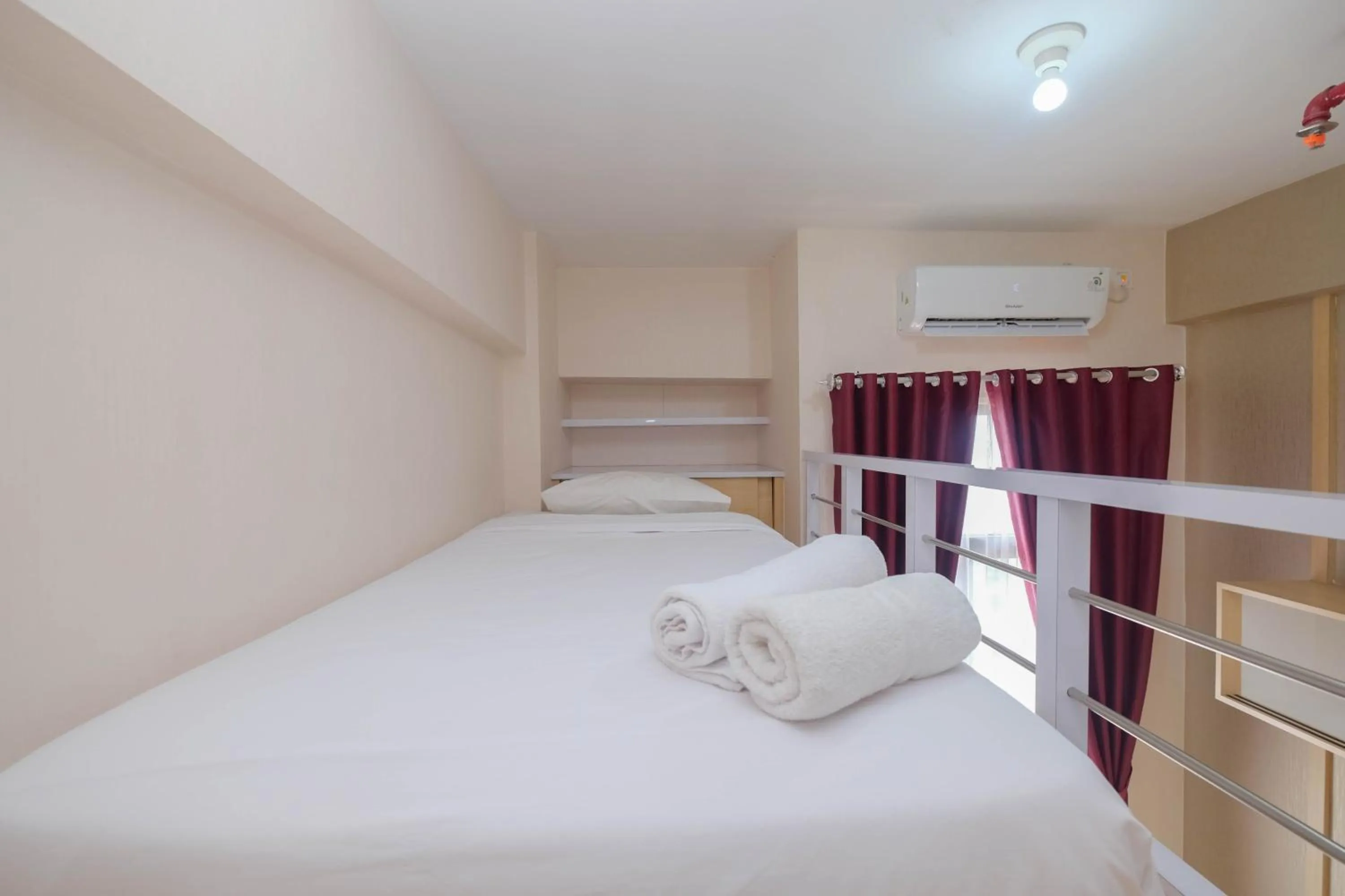 Bed in Comfy and Tidy Studio at Dave Apartment By Travelio