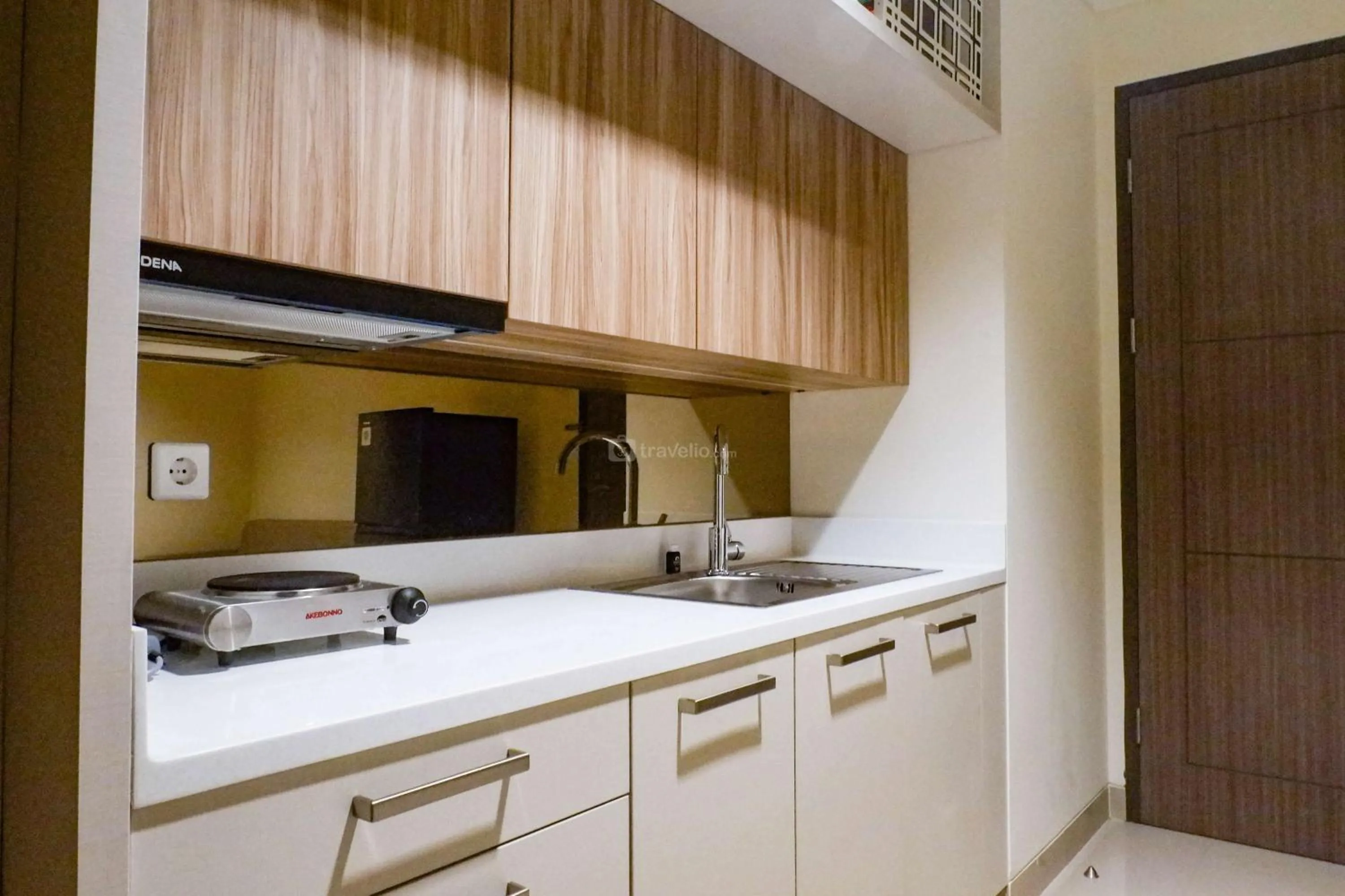 Kitchen or kitchenette in 1BR Stunning and Cozy Apartment at Praxis By Travelio