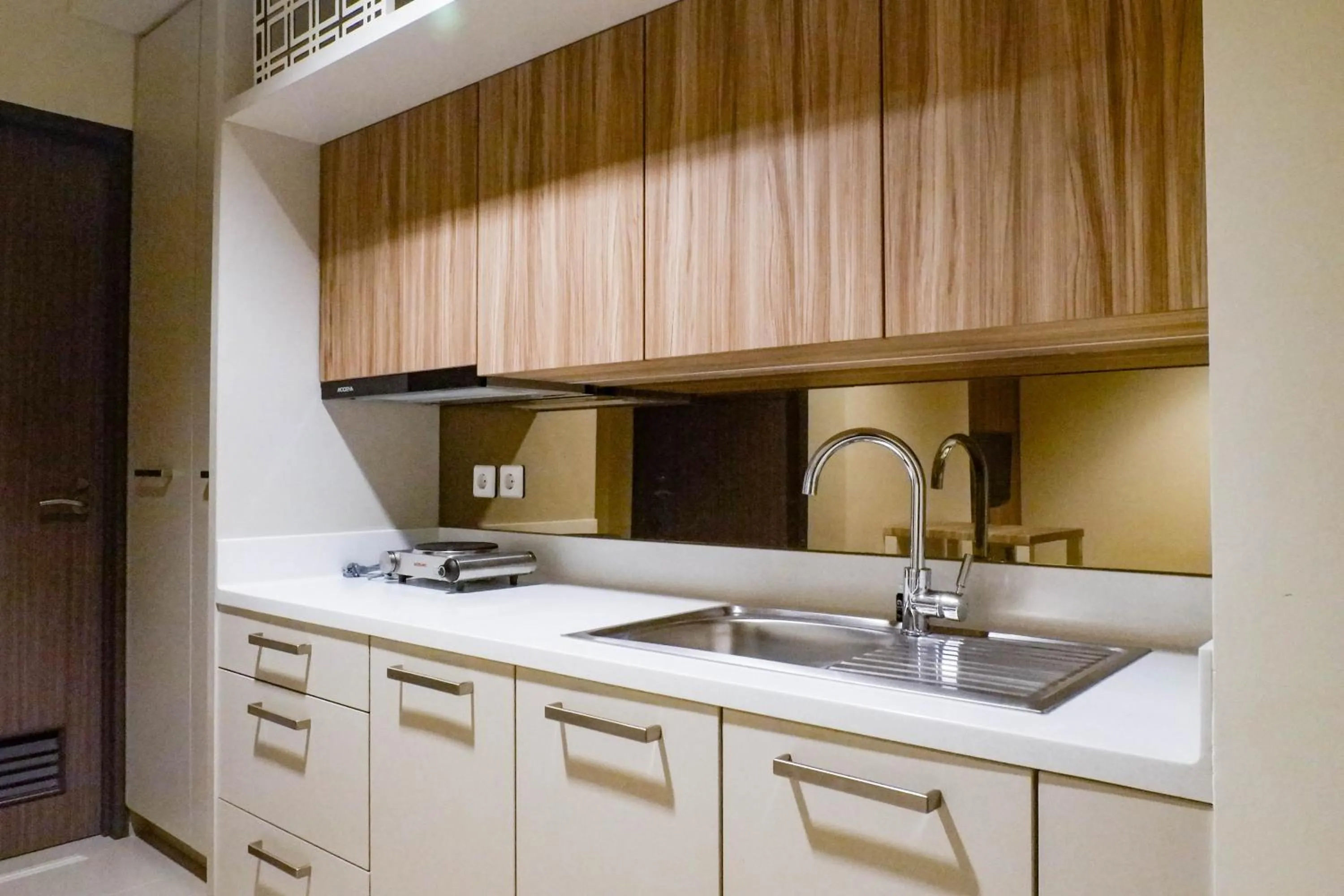 Kitchen or kitchenette in 1BR Stunning and Cozy Apartment at Praxis By Travelio