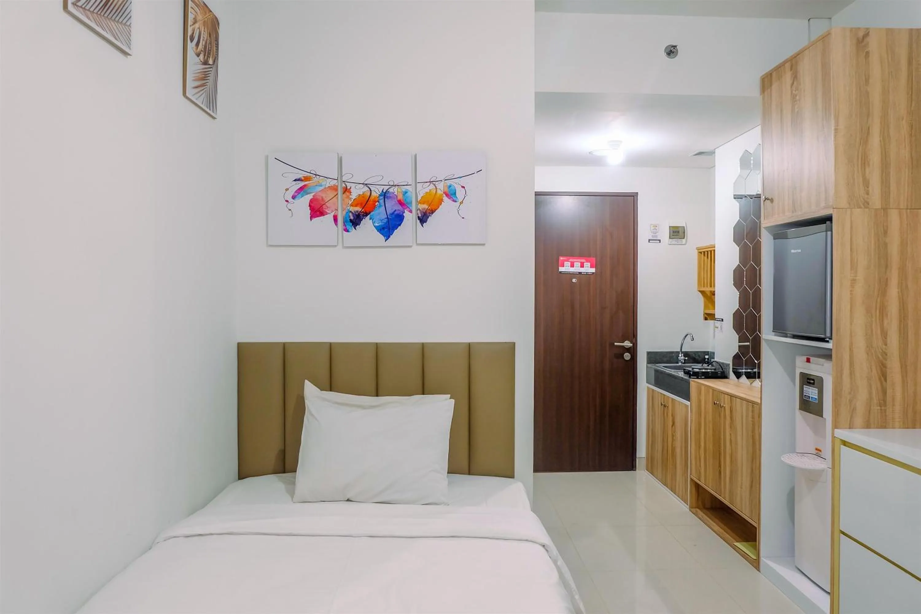 Bed in Simply and Homey Studio Transpark Cibubur Apartment By Travelio