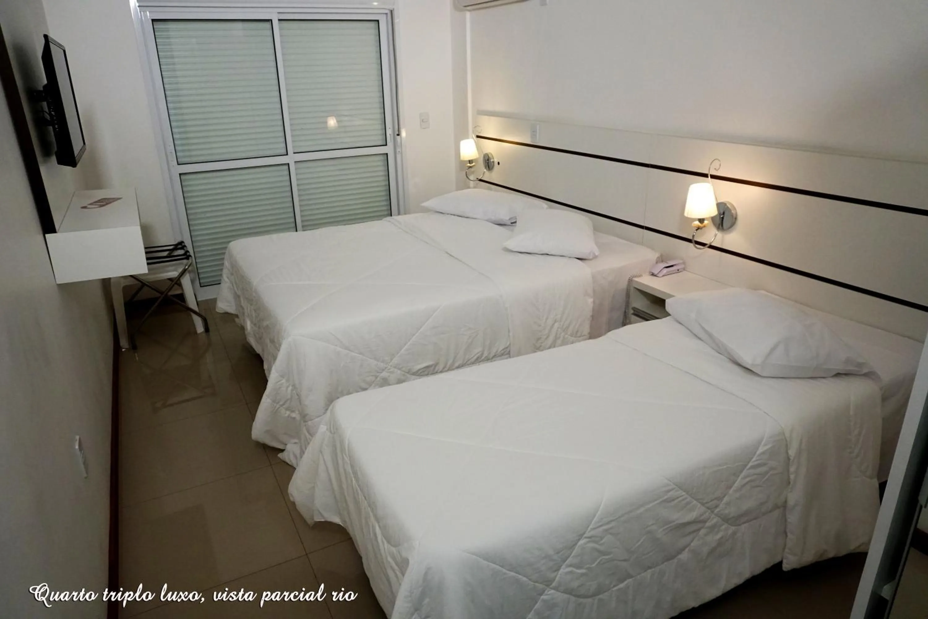 Bed in Pousada Molhes da Barra