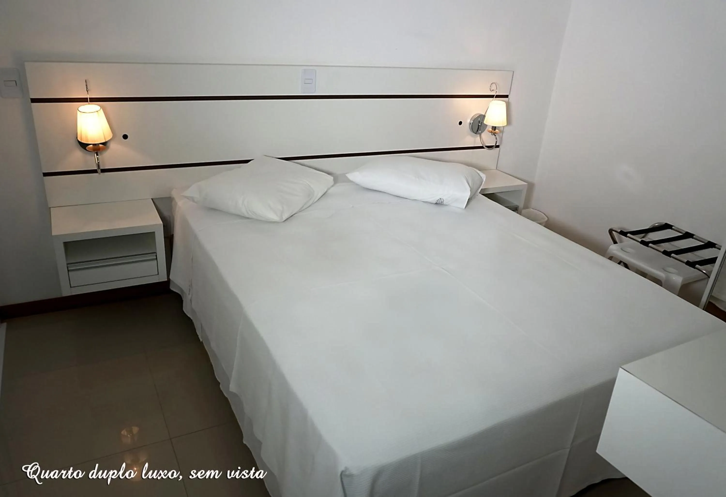 Bed in Pousada Molhes da Barra