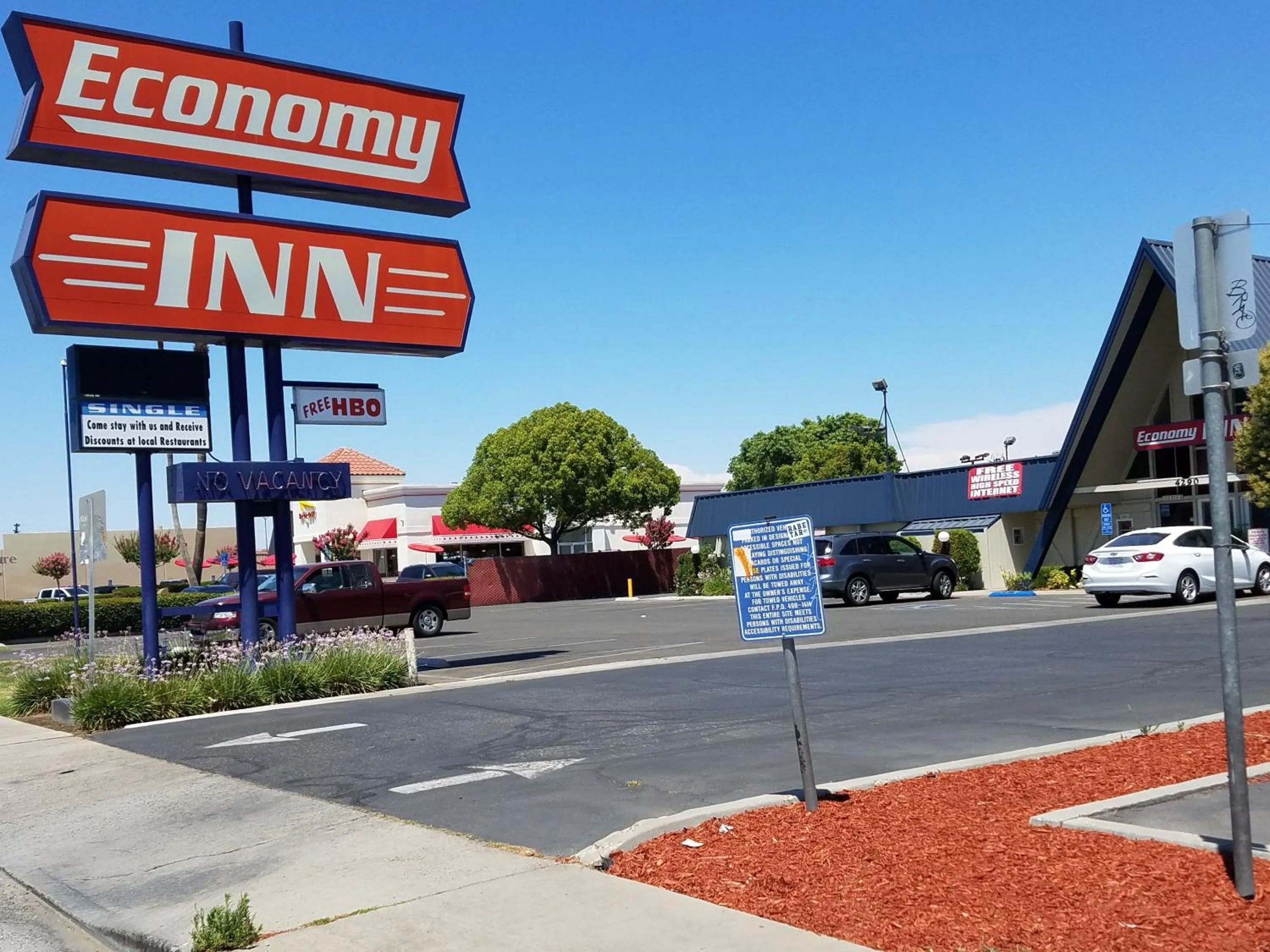Property logo or sign in Economy Inn Fresno Yosemite