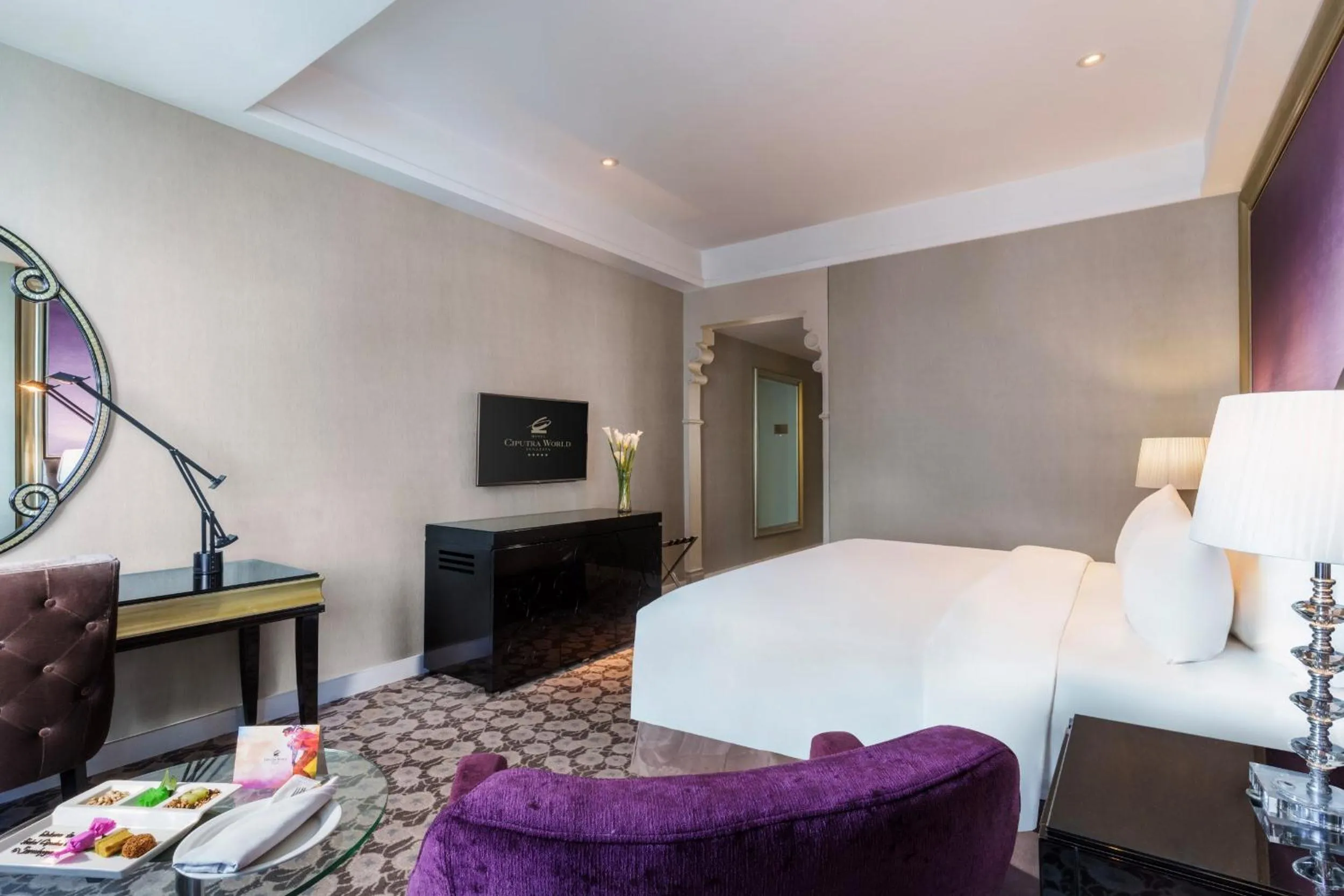 TV and multimedia, Bed in Hotel Ciputra World Surabaya managed by Swiss-Belhotel International