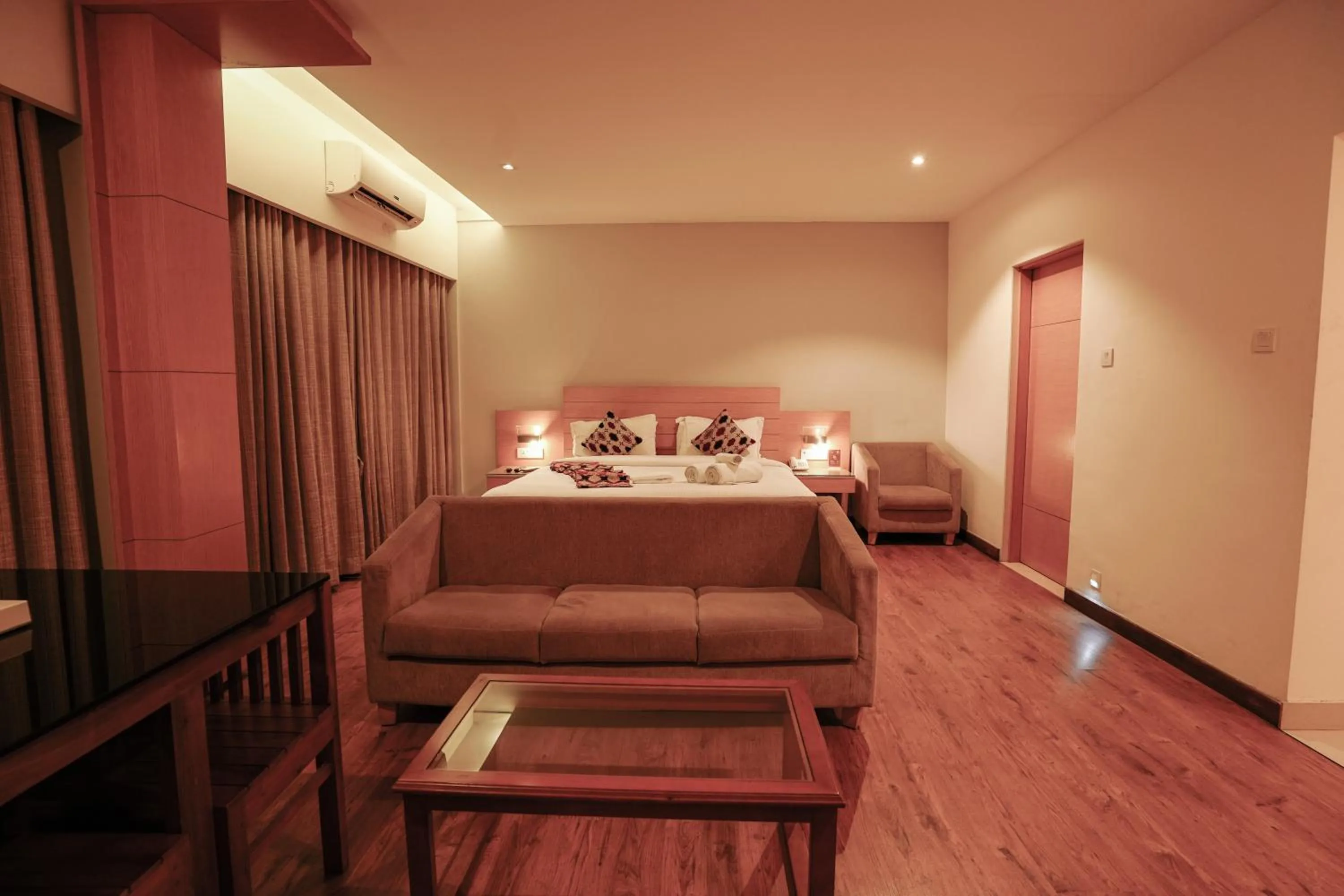 Bed in Hotel Indriya Wayanad